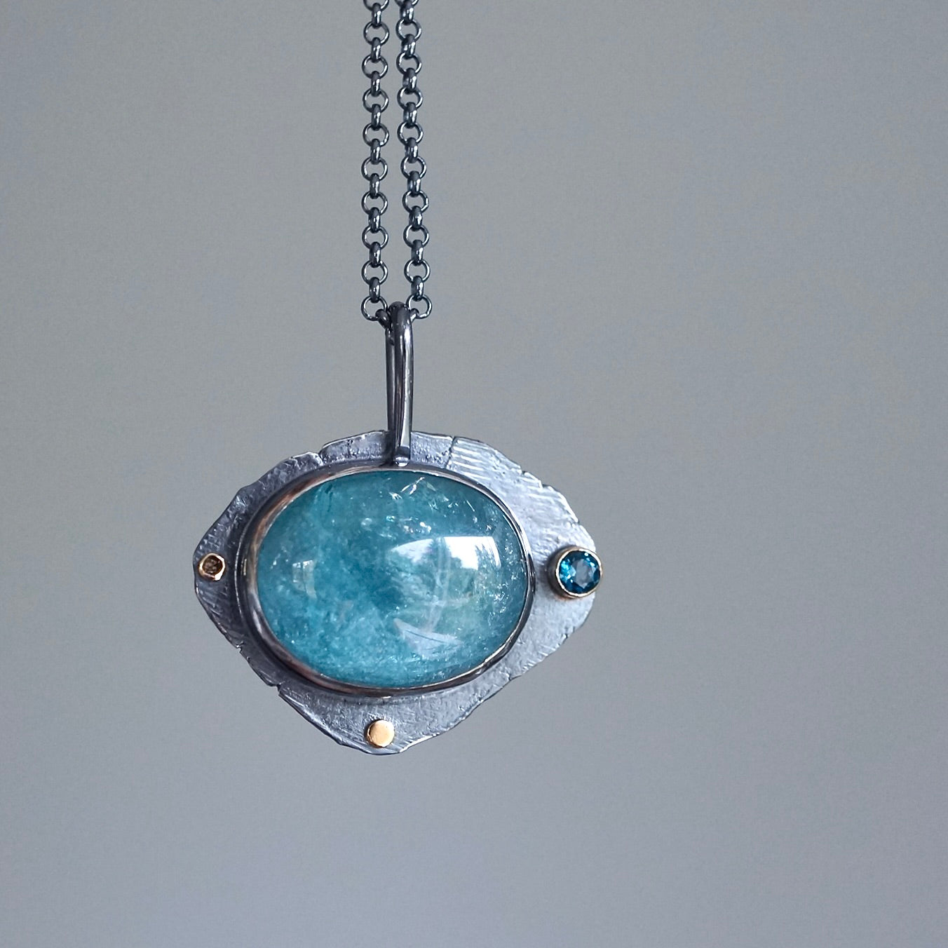 Raw blue tourmaline pendant