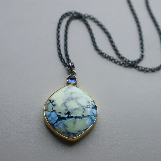 White Hotsonite and blue sapphire pendant