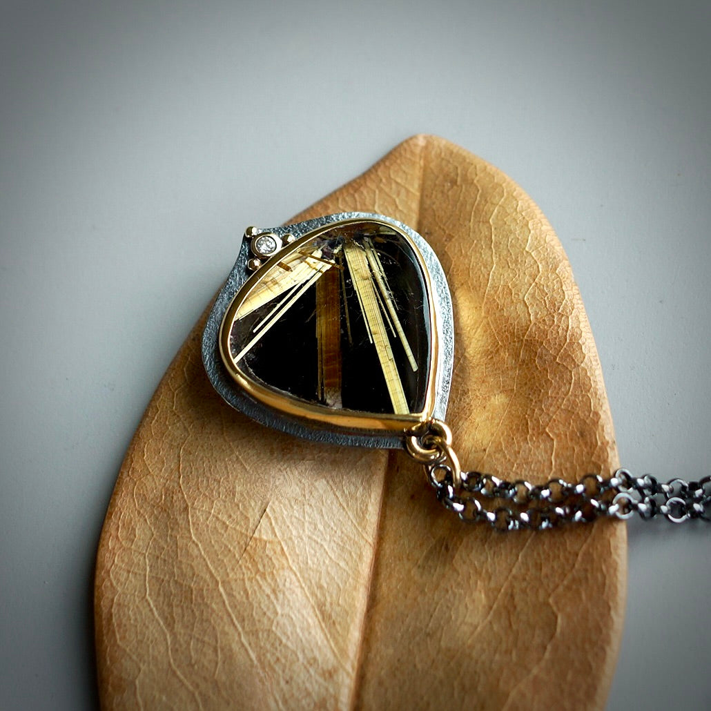 Rutilated quartz and back onyx doublet pendant with diamond