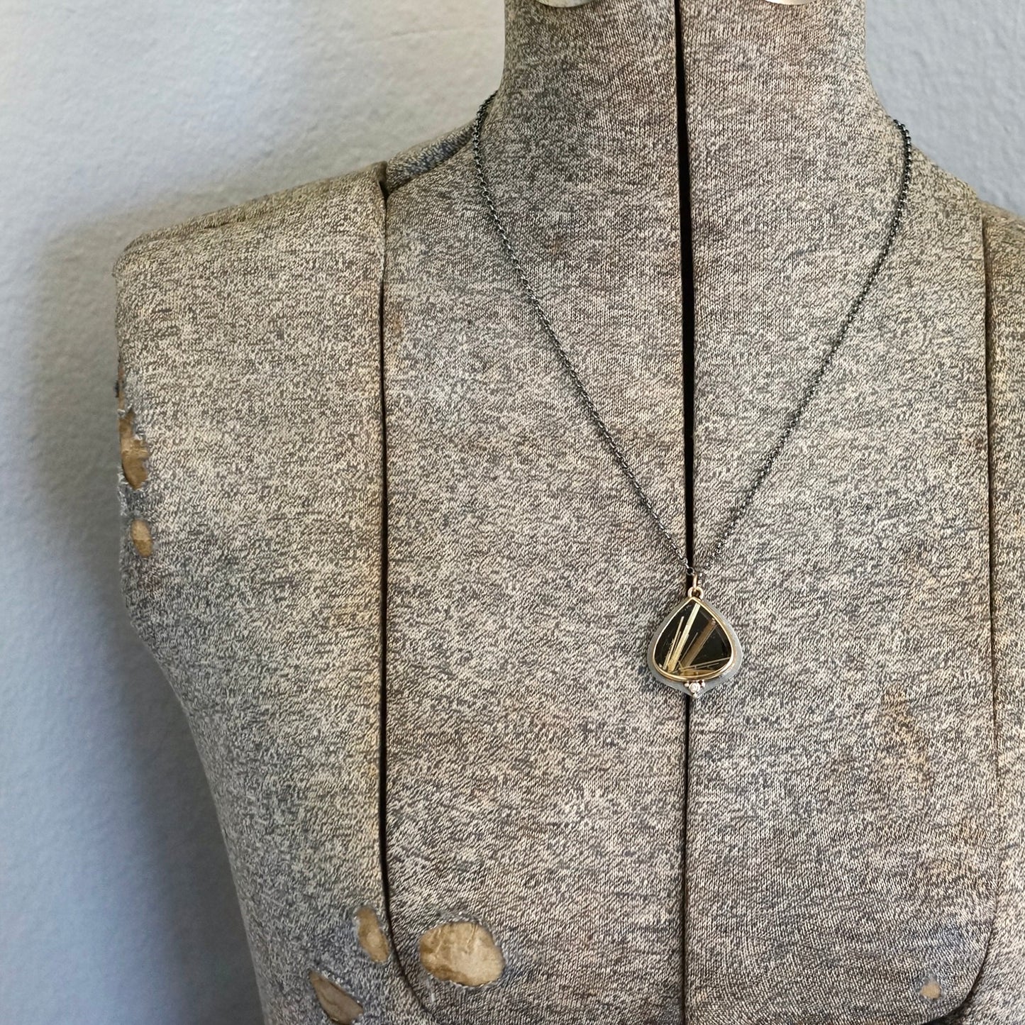 Rutilated quartz and back onyx doublet pendant with diamond