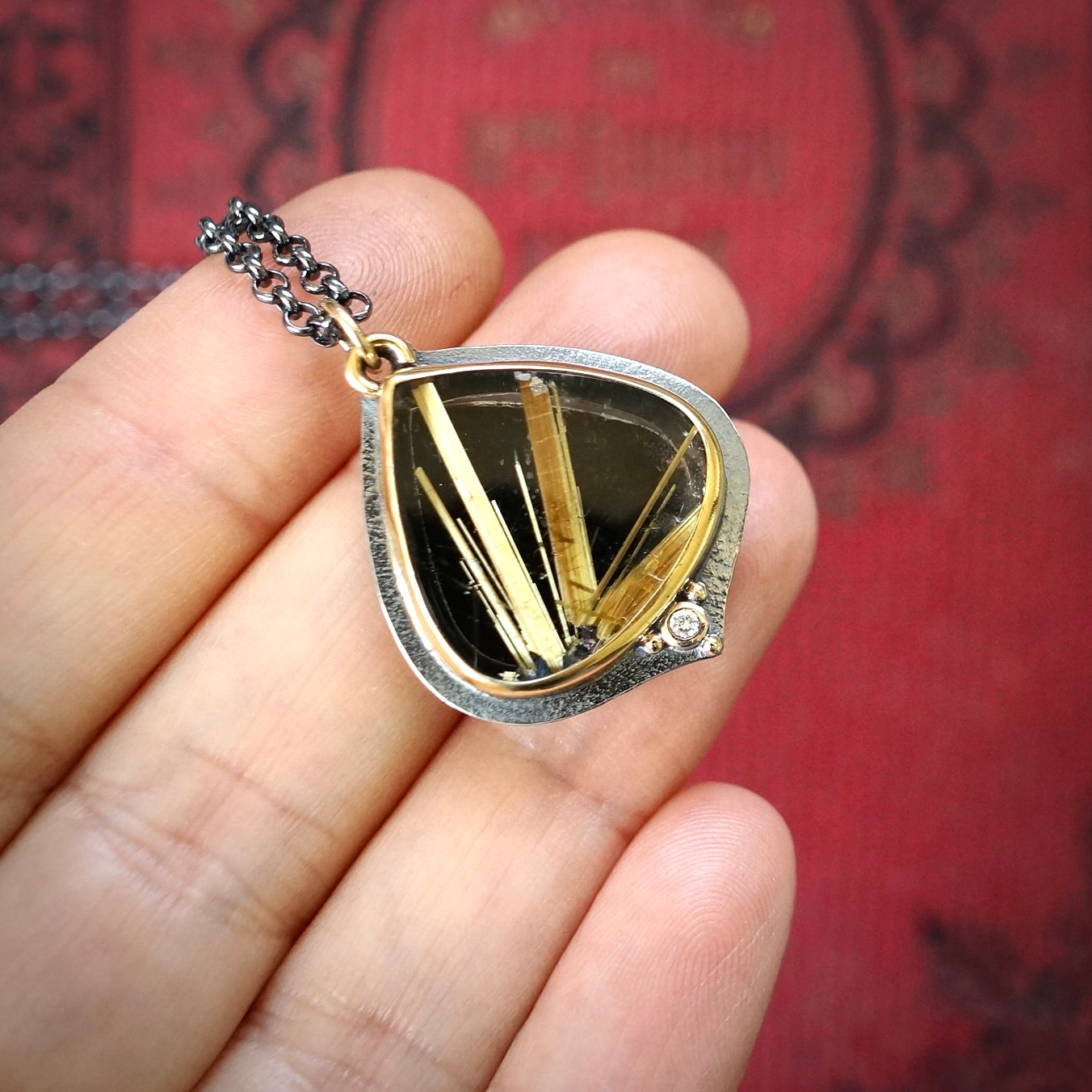 Rutilated quartz and back onyx doublet pendant with diamond