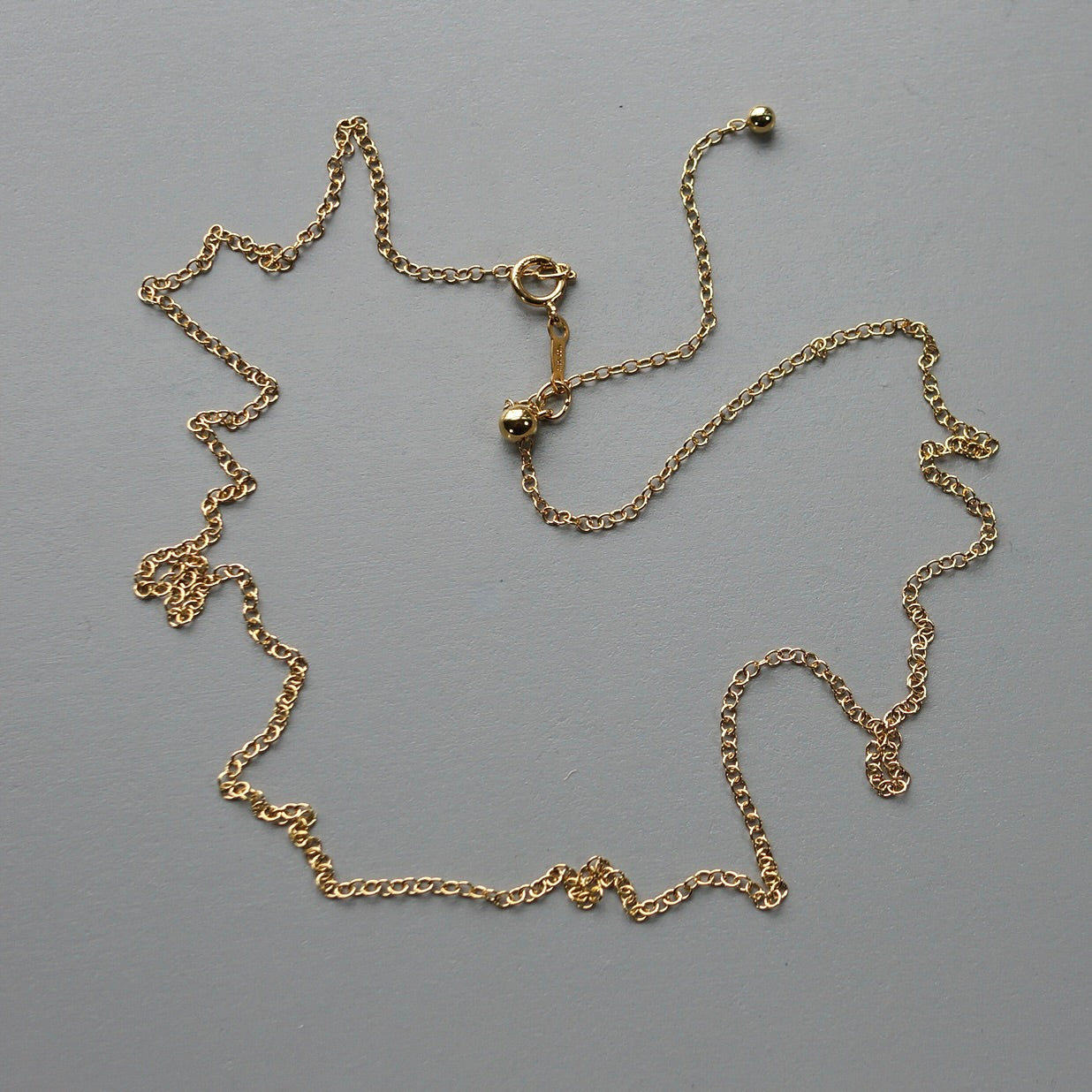 Gold filled adjustable 22" chain.