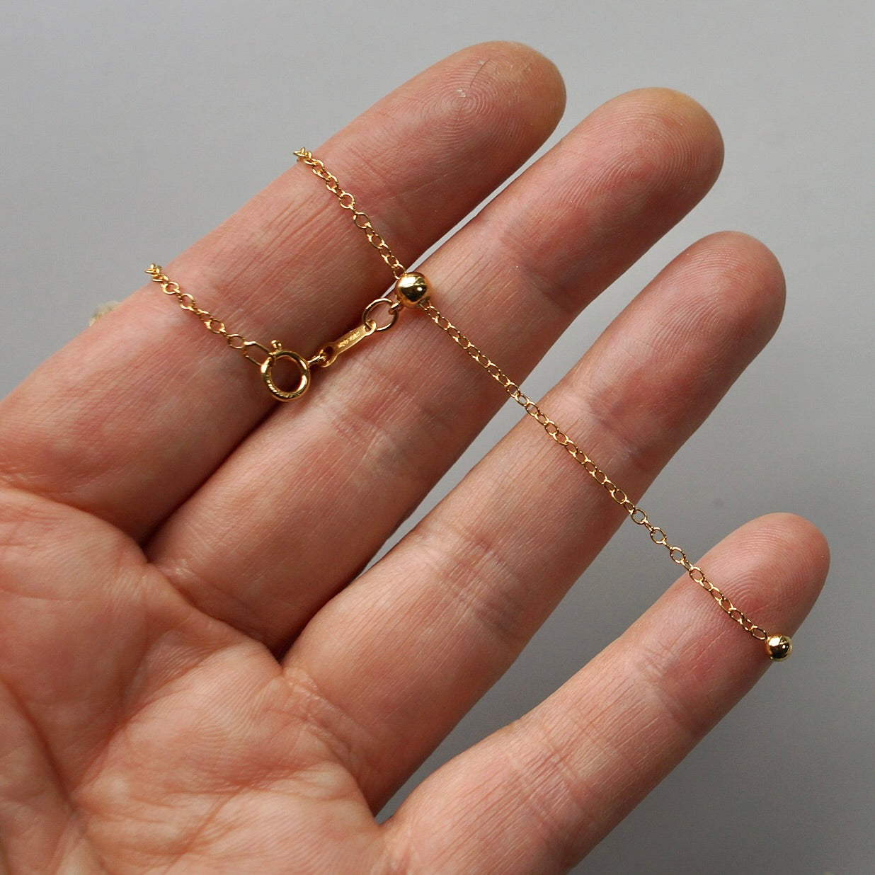 Gold filled adjustable 22" chain.