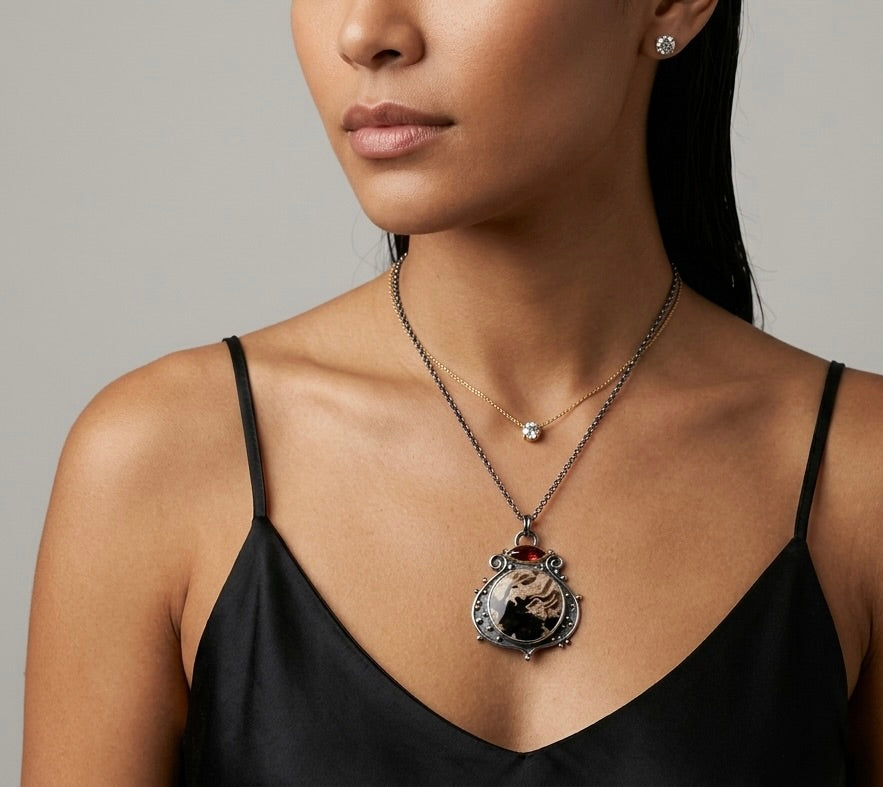 Fossil palm root and garnet pendant