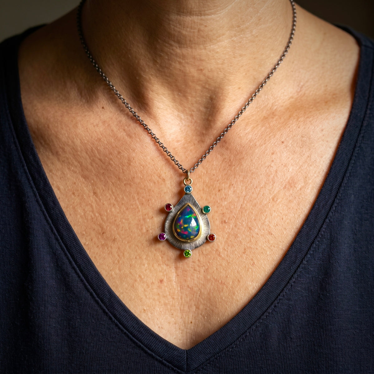 Ethiopian black opal pendant with colorful accents