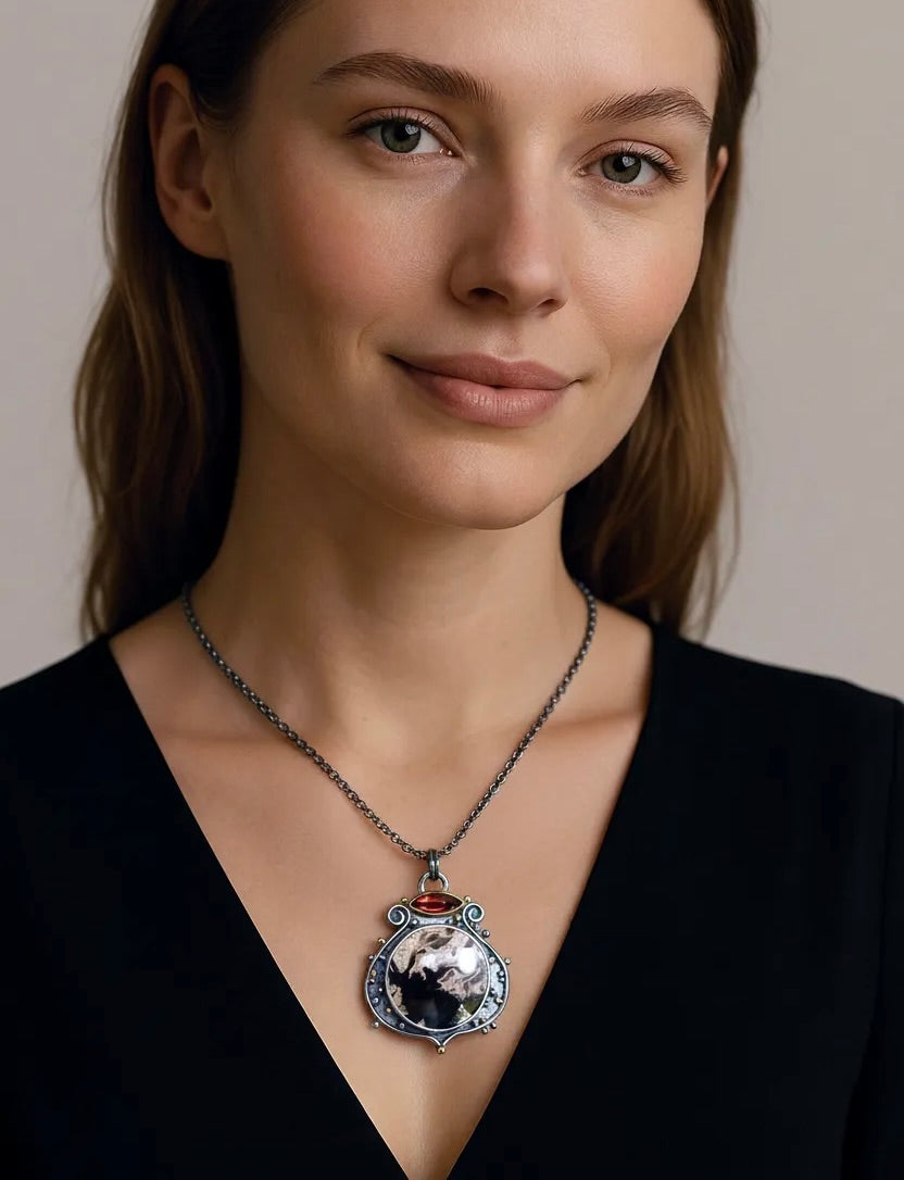 Fossil palm root and garnet pendant