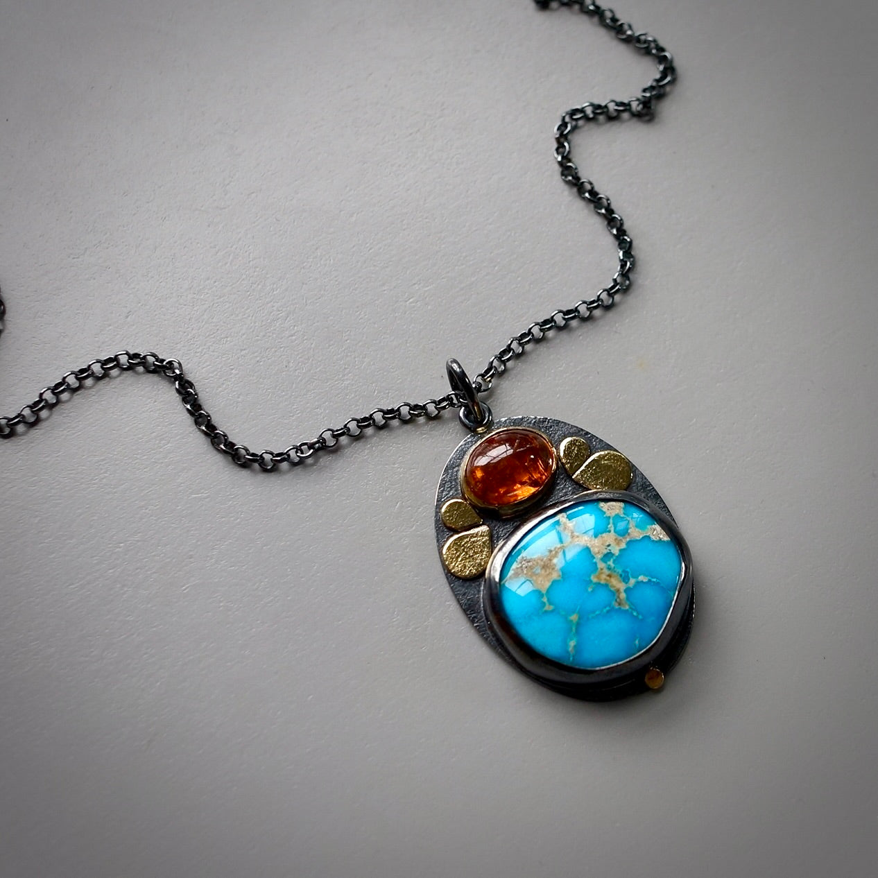 Sonoran blue turquoise and spessartine garnet pendant