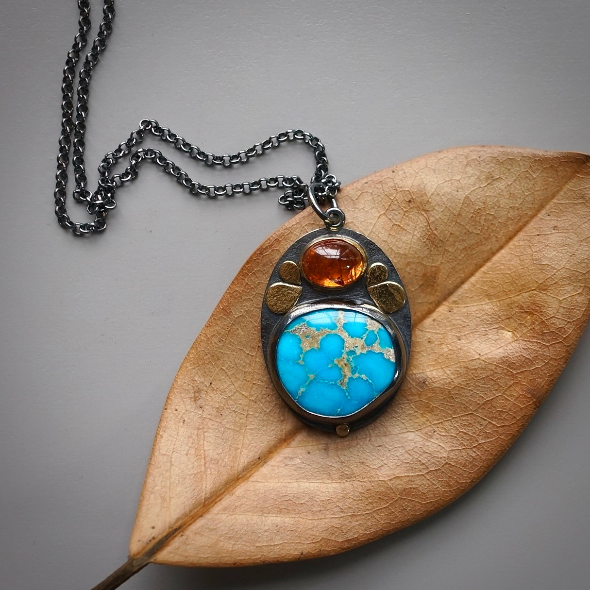 Sonoran blue turquoise and spessartine garnet pendant