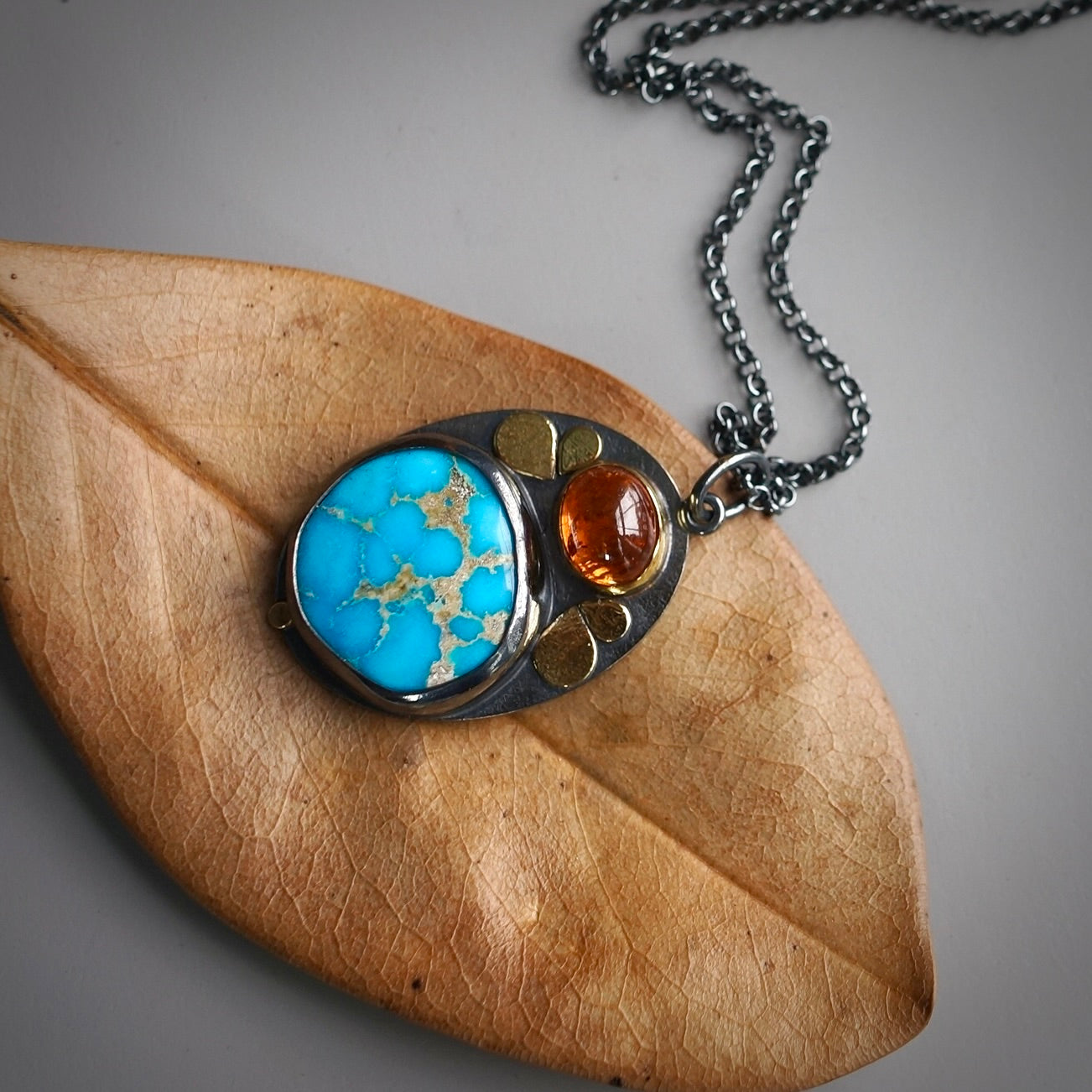 Sonoran blue turquoise and spessartine garnet pendant