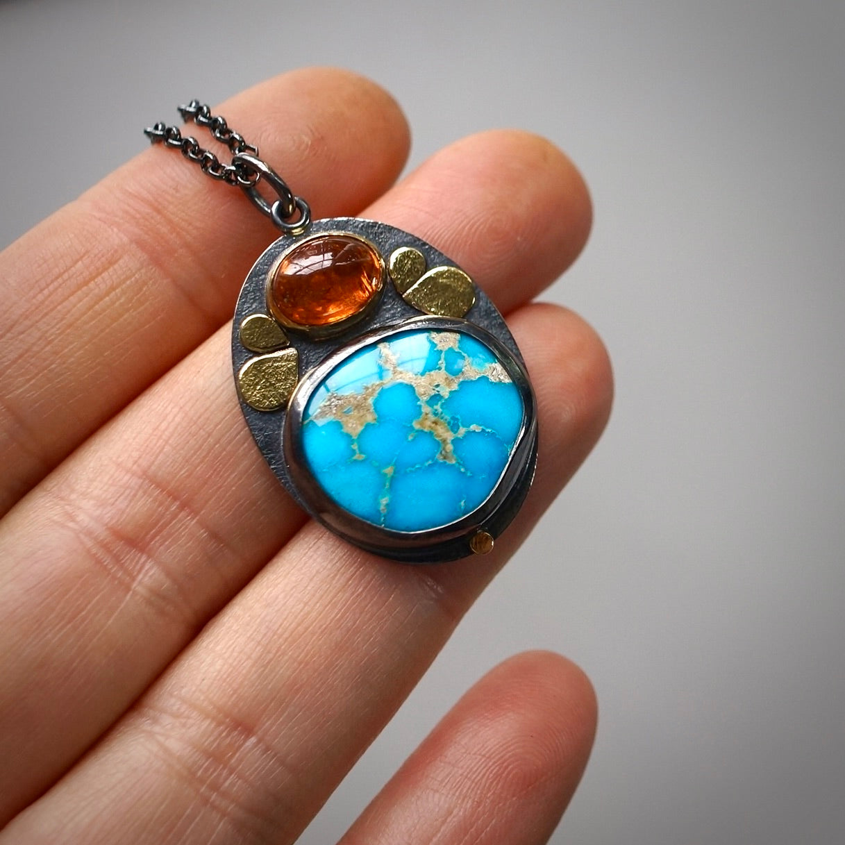 Sonoran blue turquoise and spessartine garnet pendant