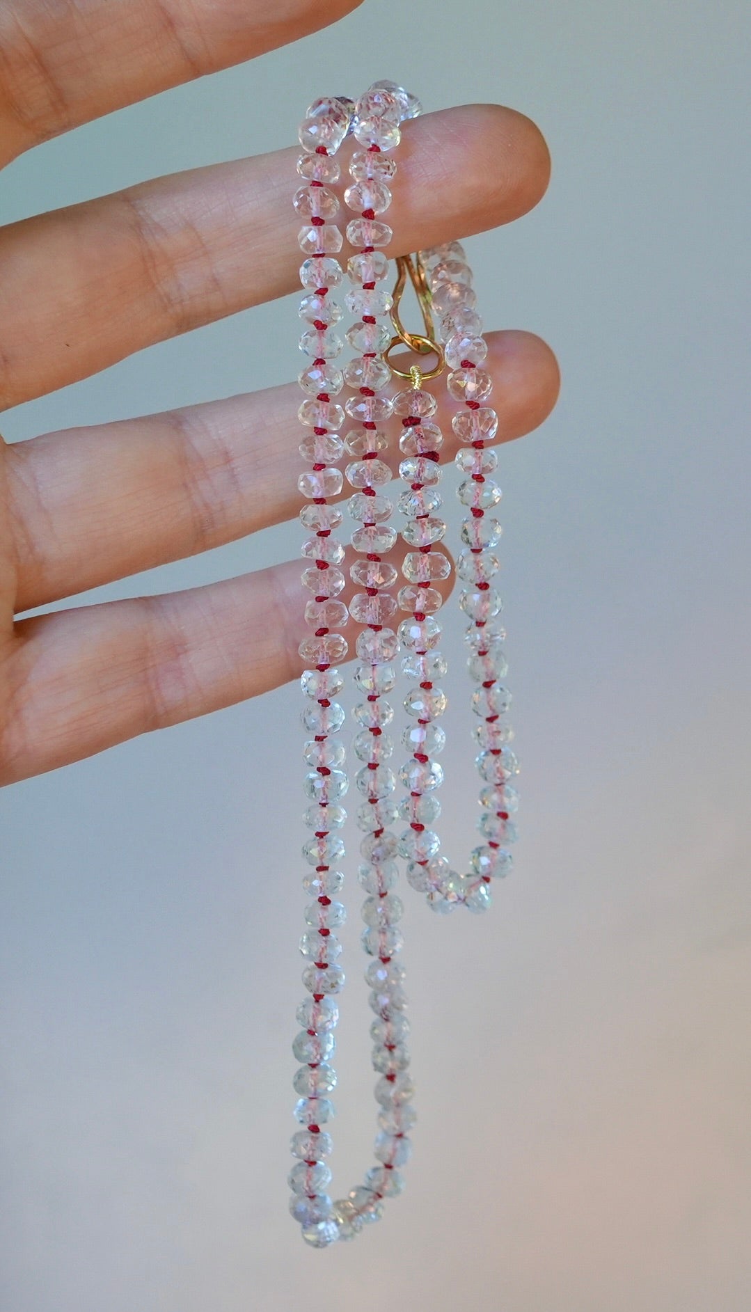 20” White Topaz necklace hand-knotted with red silk