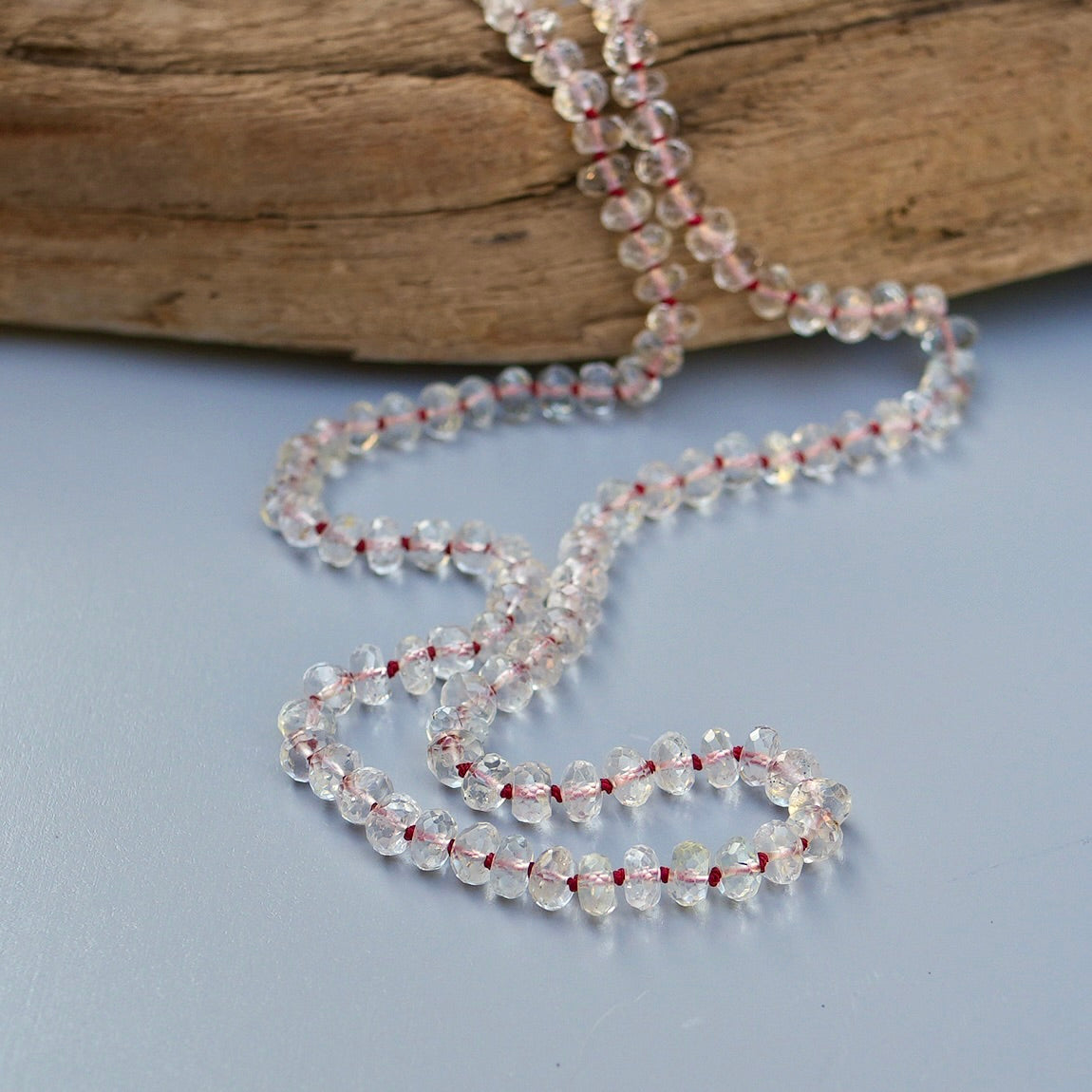 20” White Topaz necklace hand-knotted with red silk