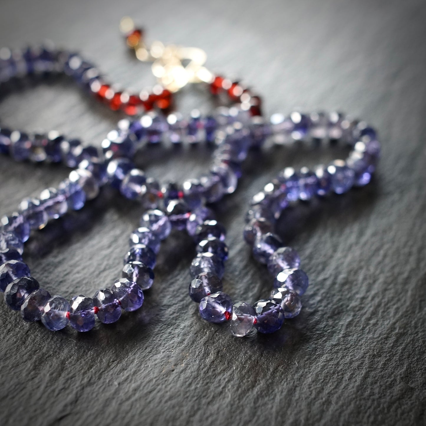 Knotted Iolite and garnet necklace