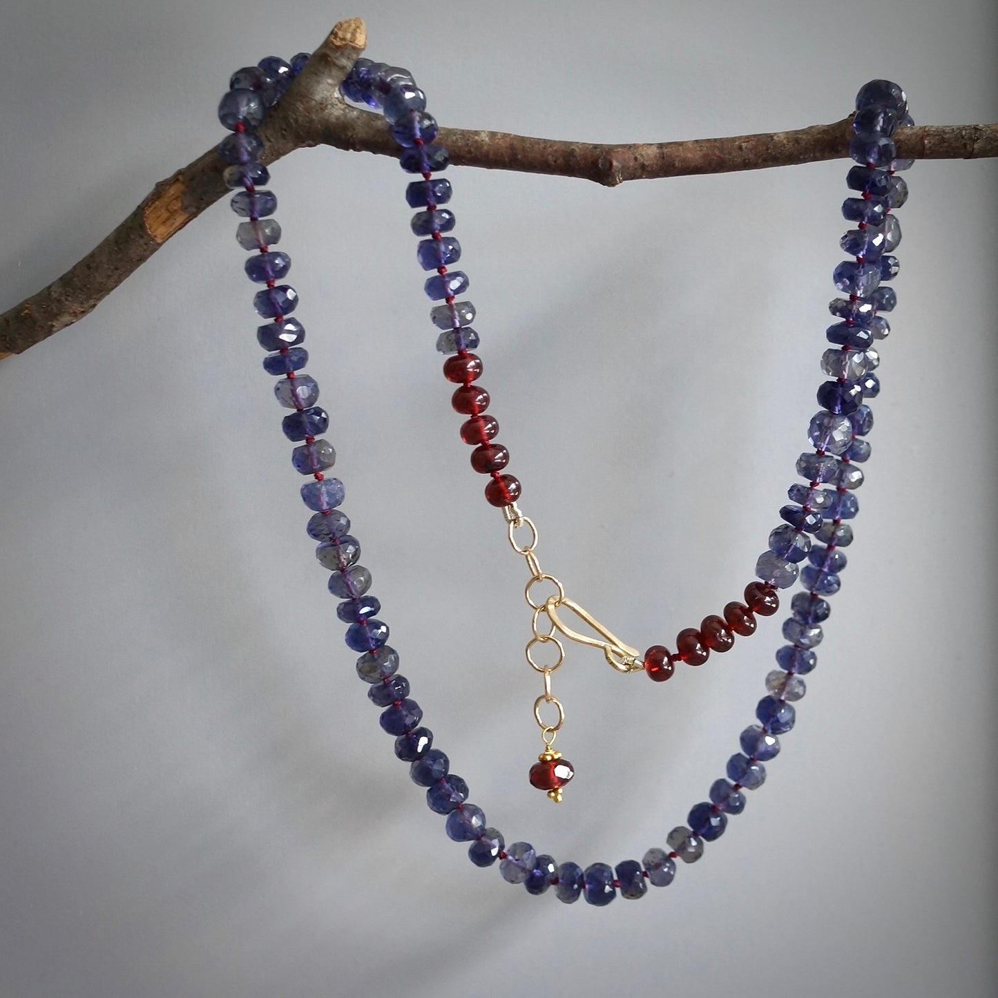 Knotted Iolite and garnet necklace