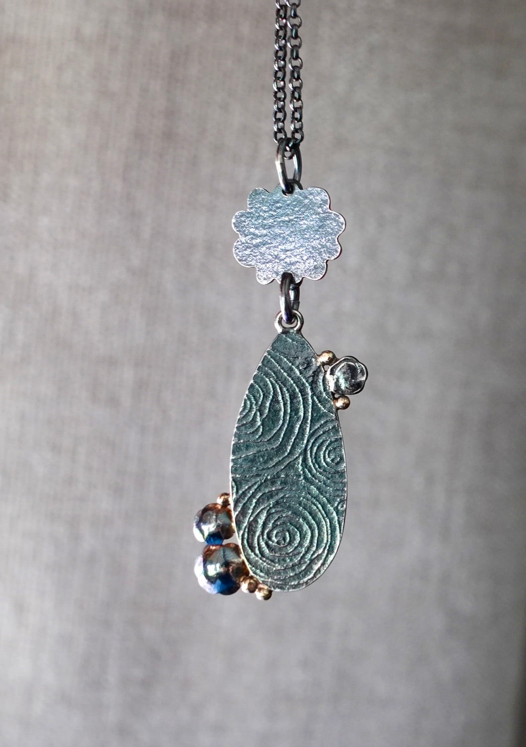 Grandidierite and malachite-chrysocolla flowering pendant