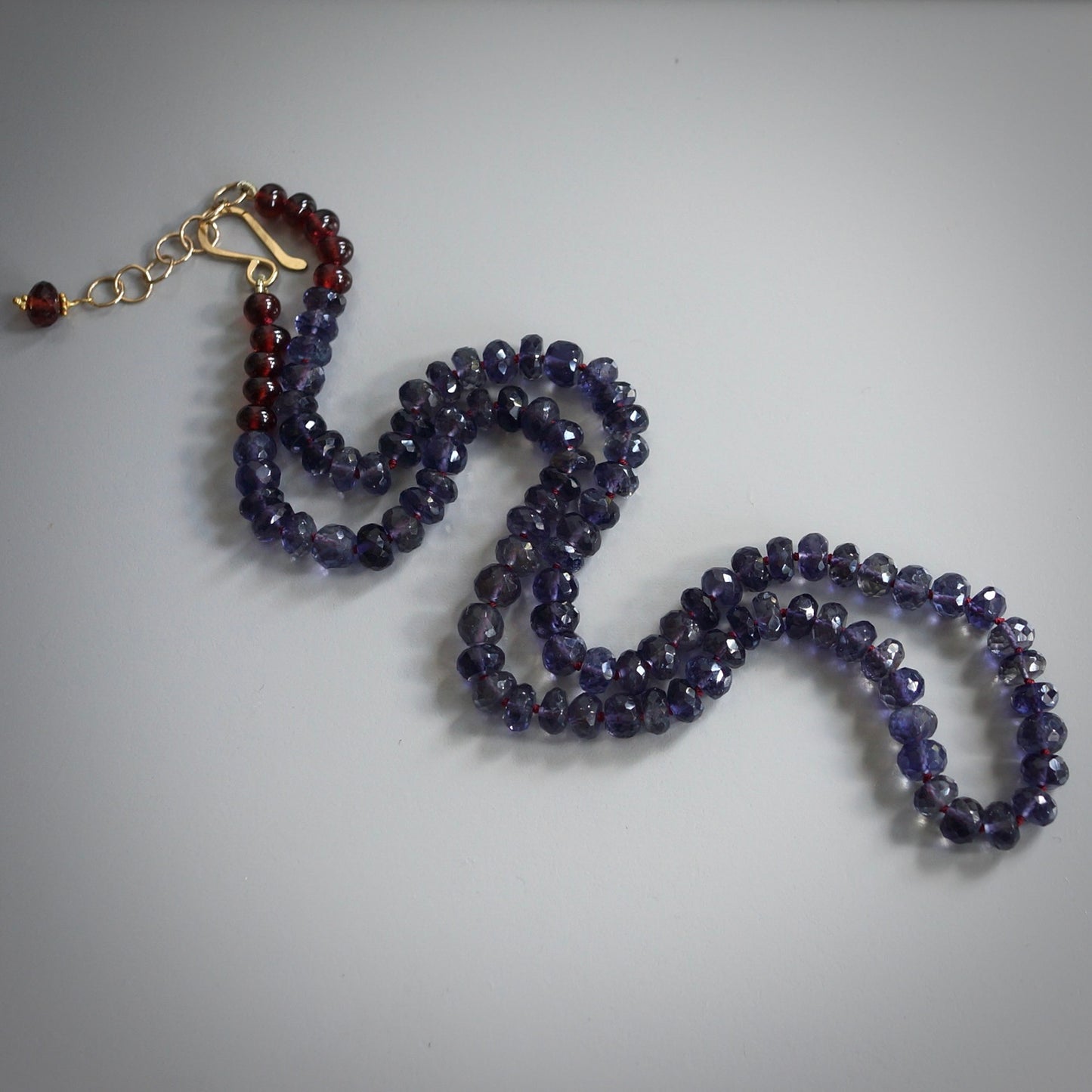 Knotted Iolite and garnet necklace