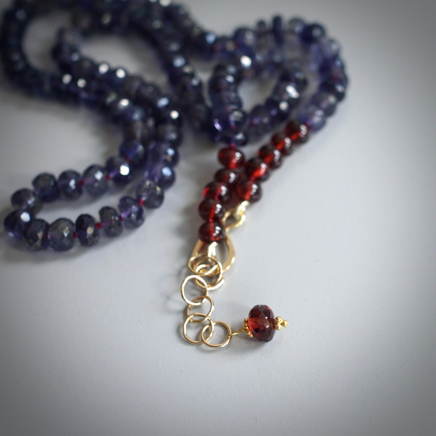 Knotted Iolite and garnet necklace