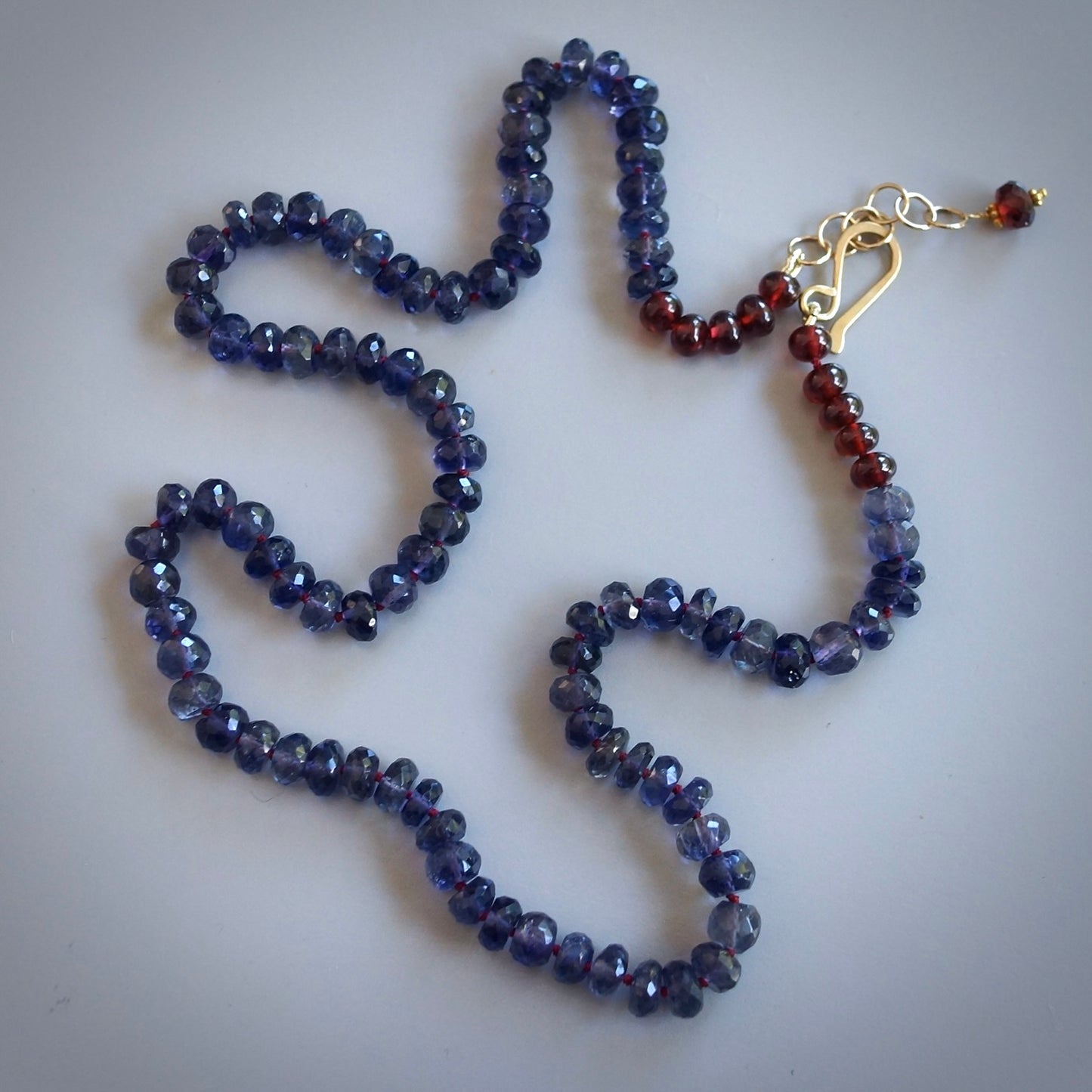 Knotted Iolite and garnet necklace