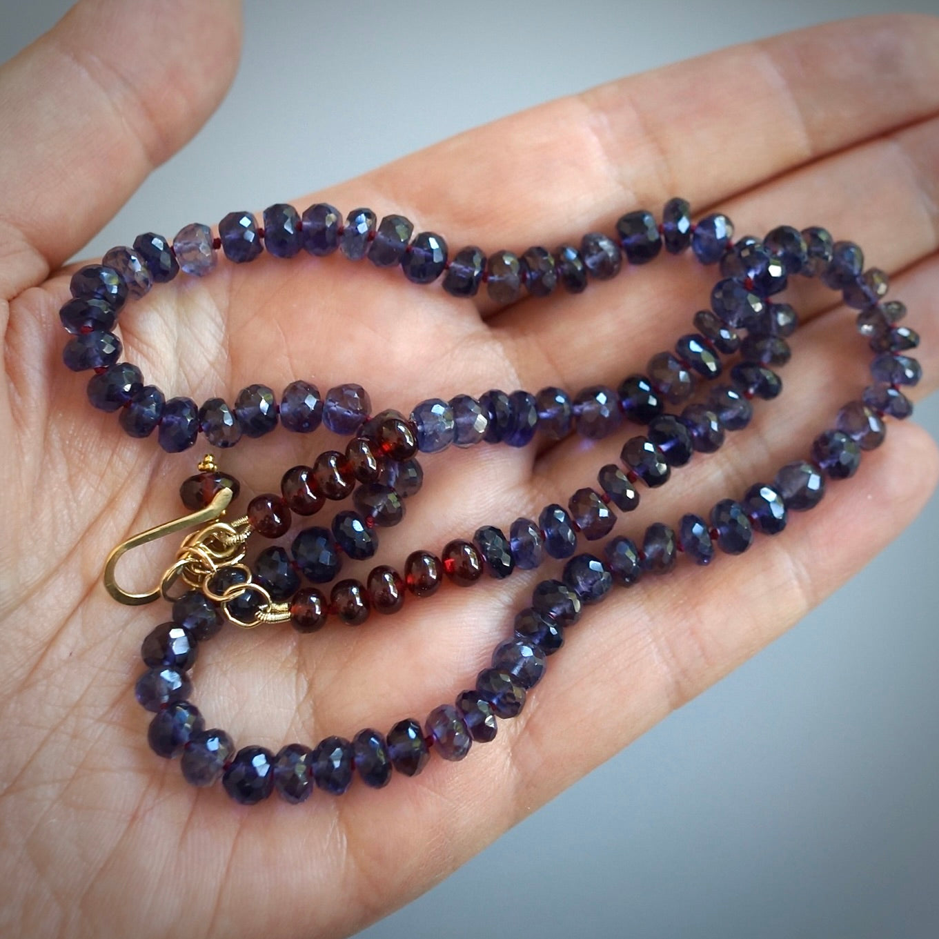 Knotted Iolite and garnet necklace