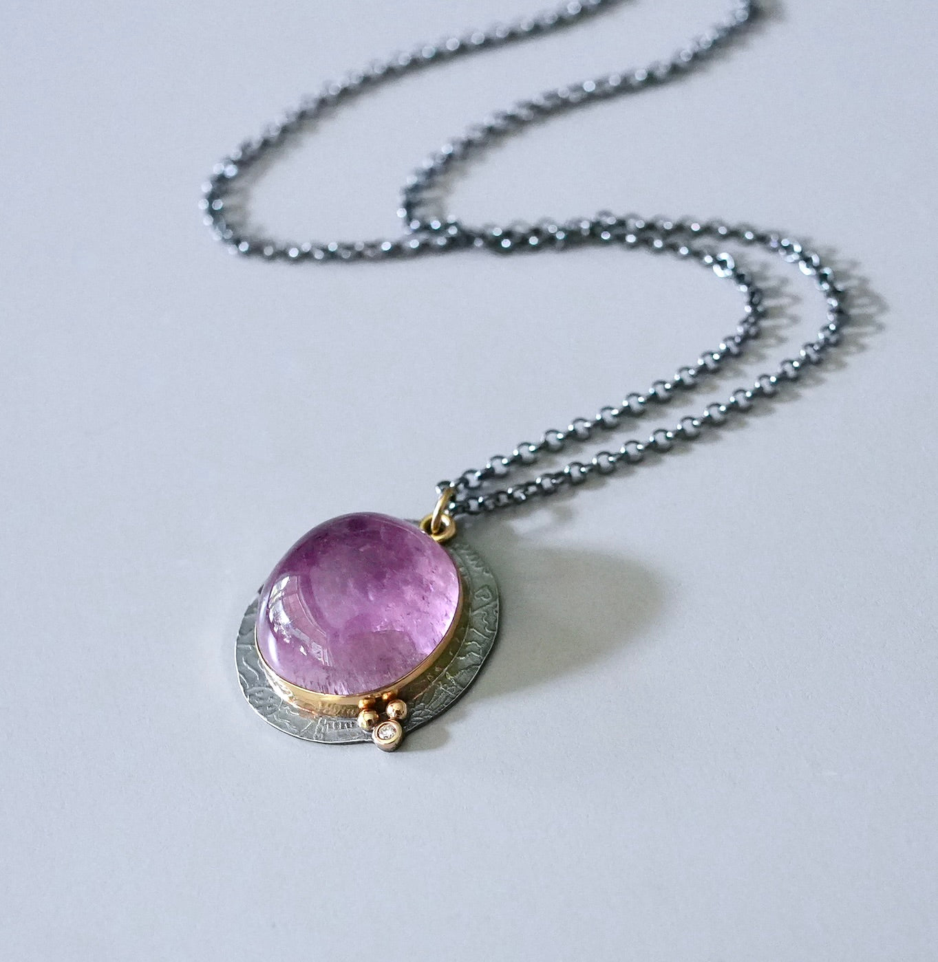 Kunzite and diamond pendant