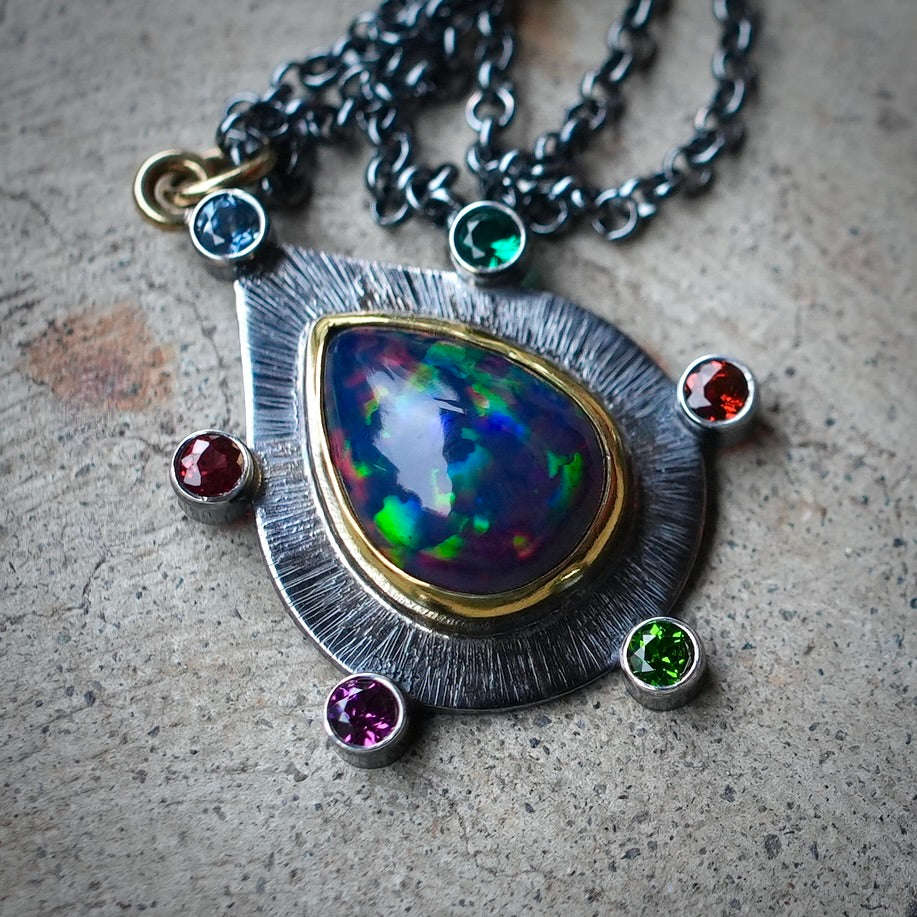 Ethiopian black opal pendant with colorful accents