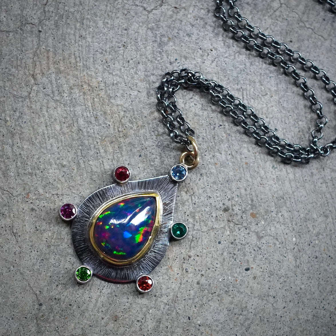 Ethiopian black opal pendant with colorful accents