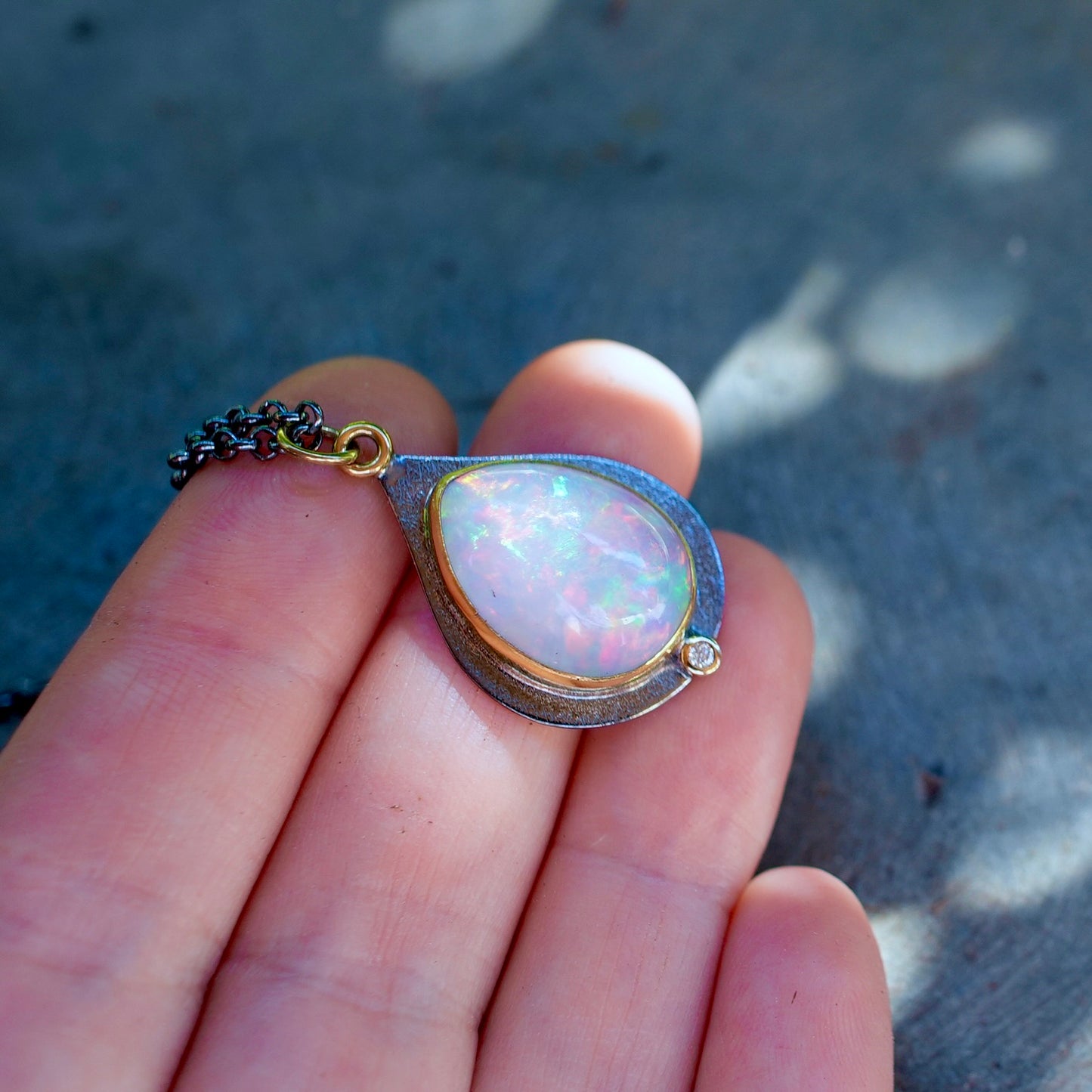 Ethiopian opal and diamond pendant
