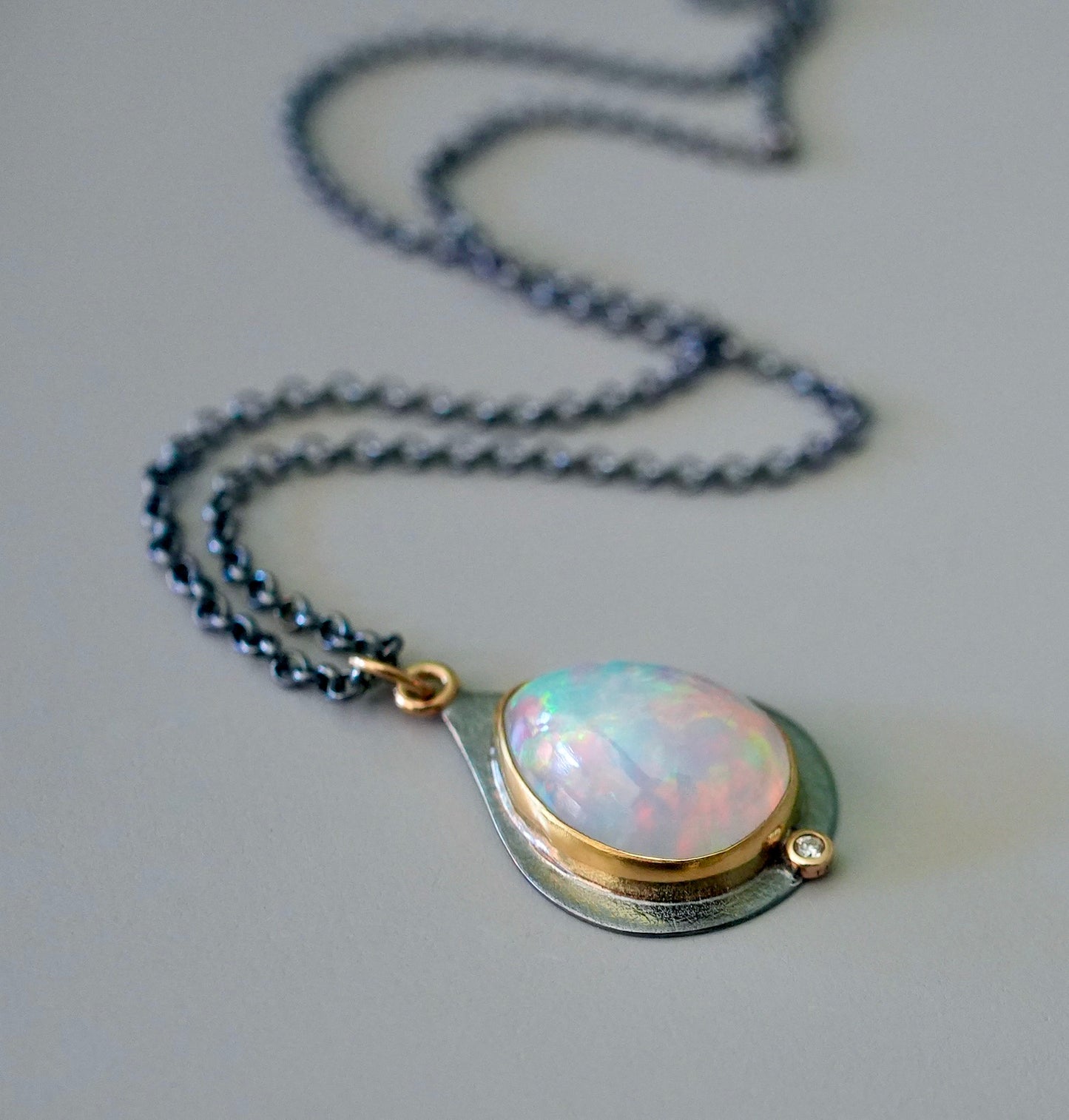 Ethiopian opal and diamond pendant