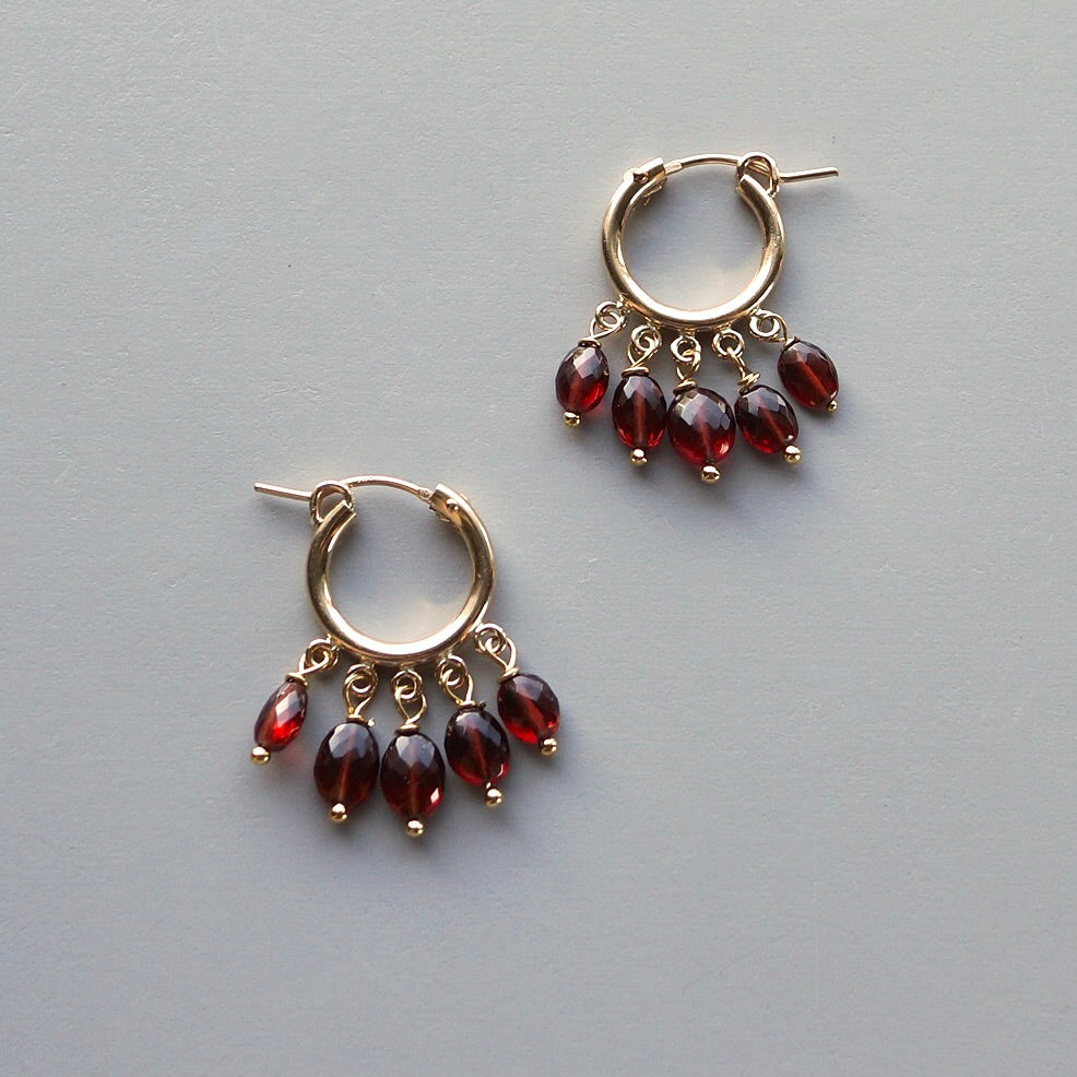 Gold filled hoops with Malaya garnet