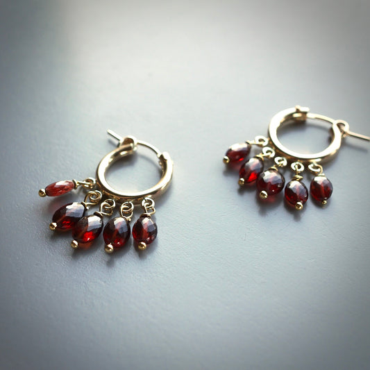 Gold filled hoops with Malaya garnet