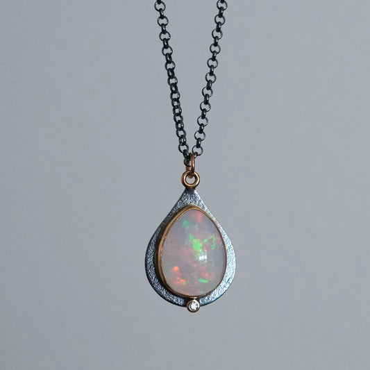 Ethiopian opal and diamond pendant