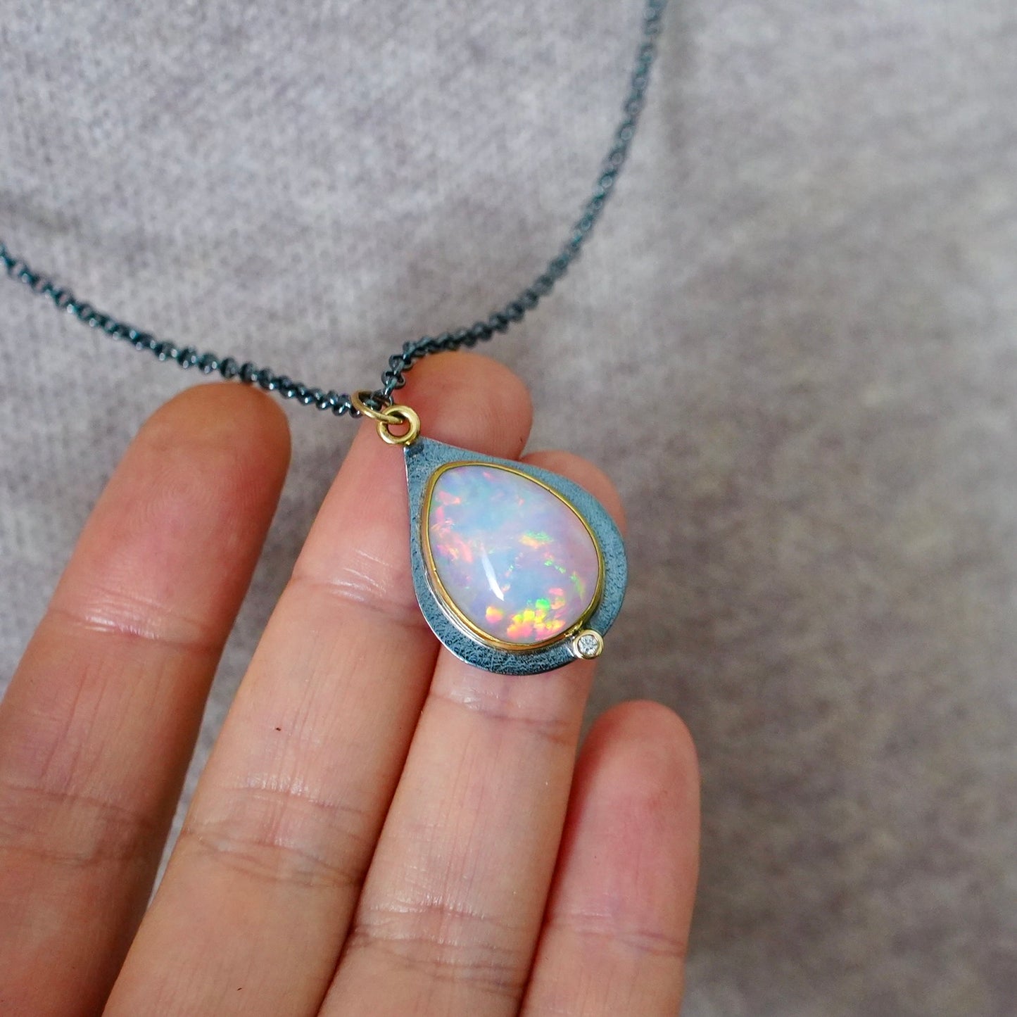 Ethiopian opal and diamond pendant