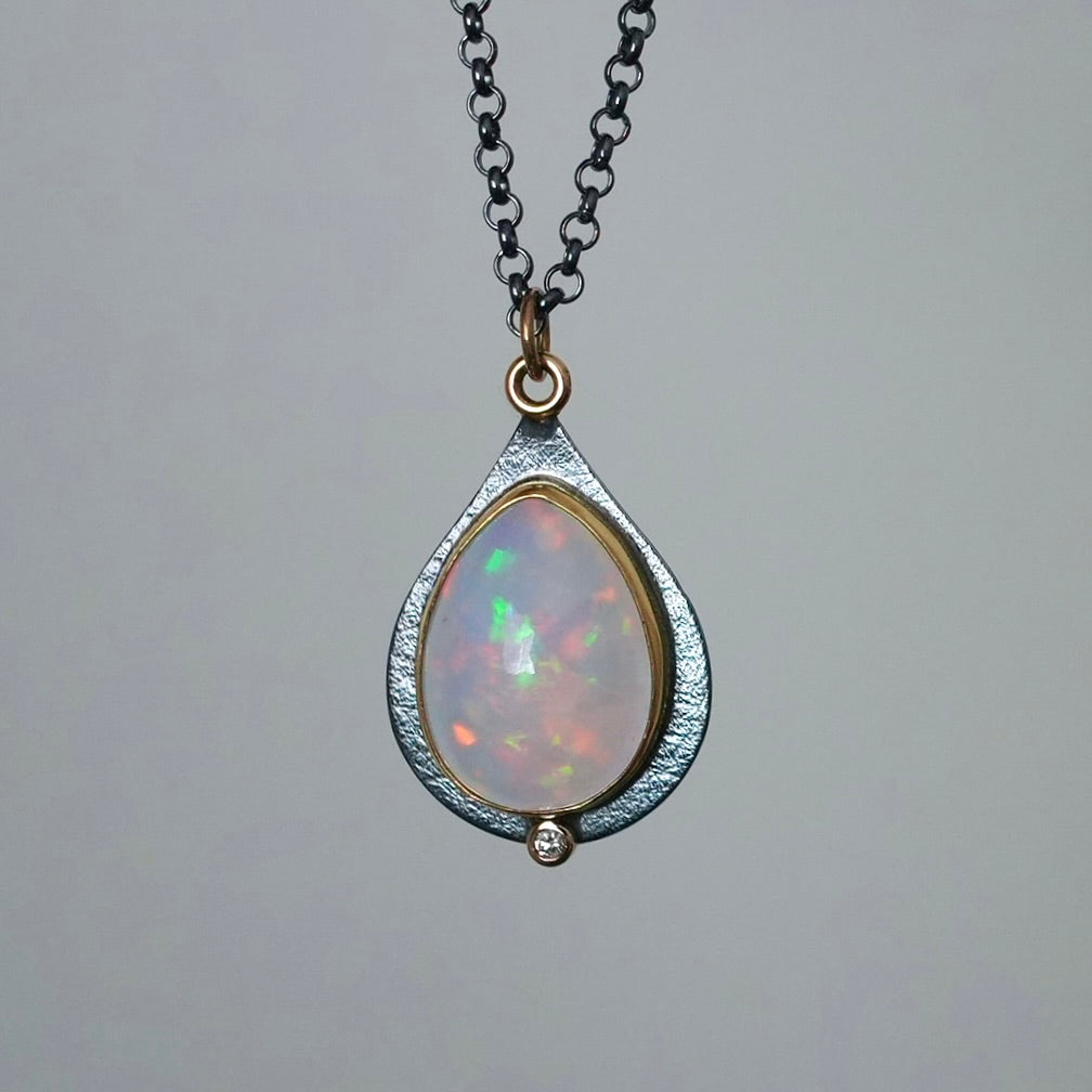 Ethiopian opal and diamond pendant