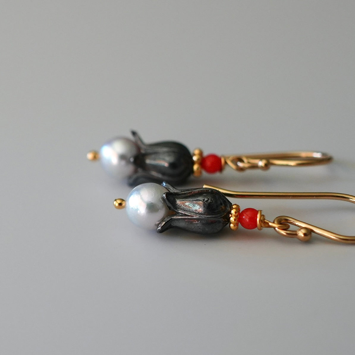 Akoya pearl earrings with tiny red coral