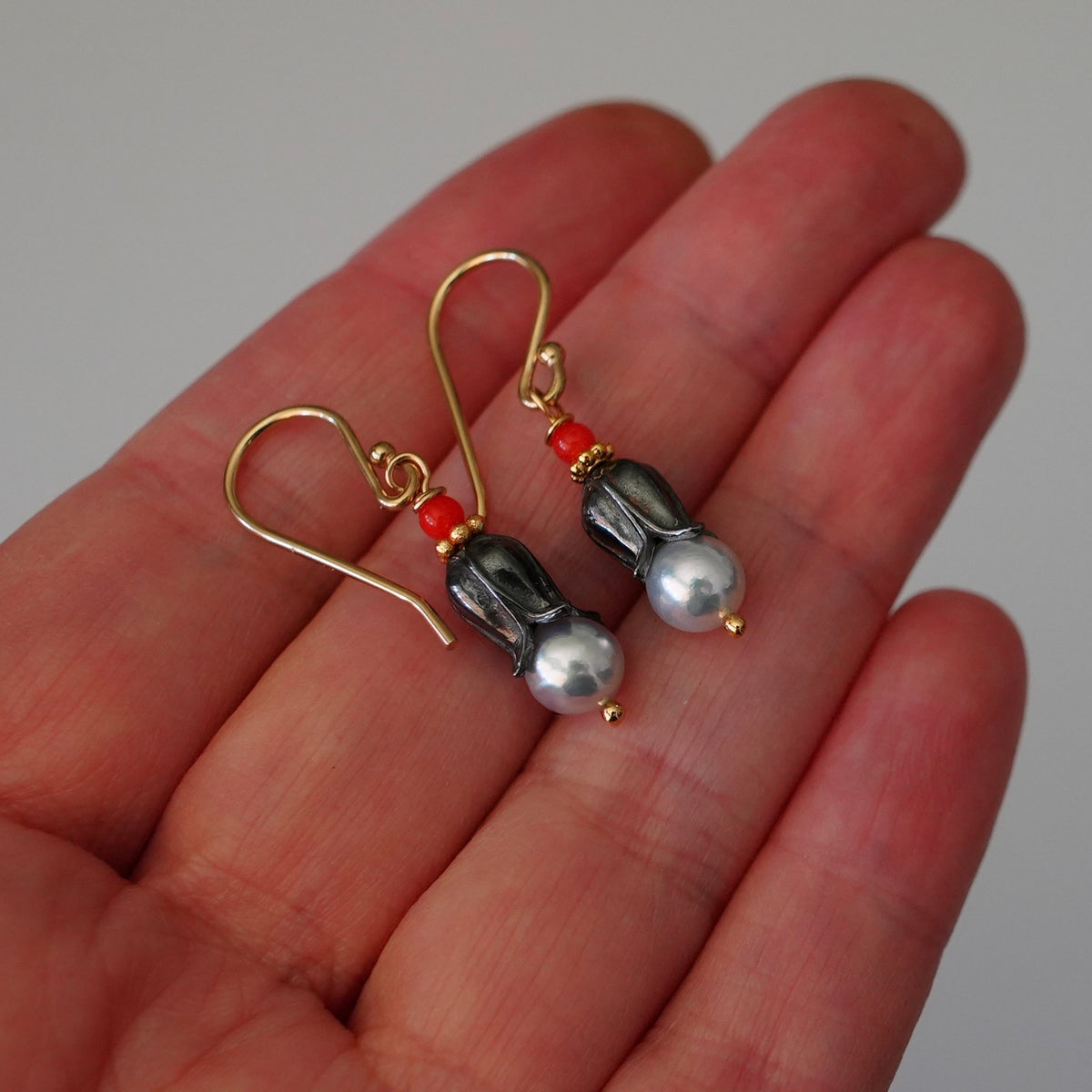 Akoya pearl earrings with tiny red coral