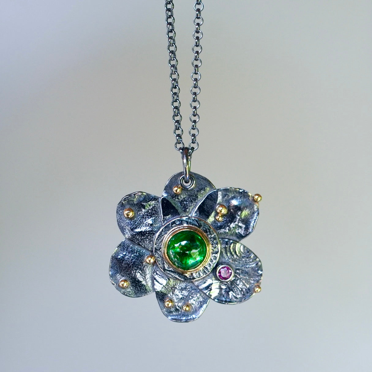 Tsavorite garnet flower pendant