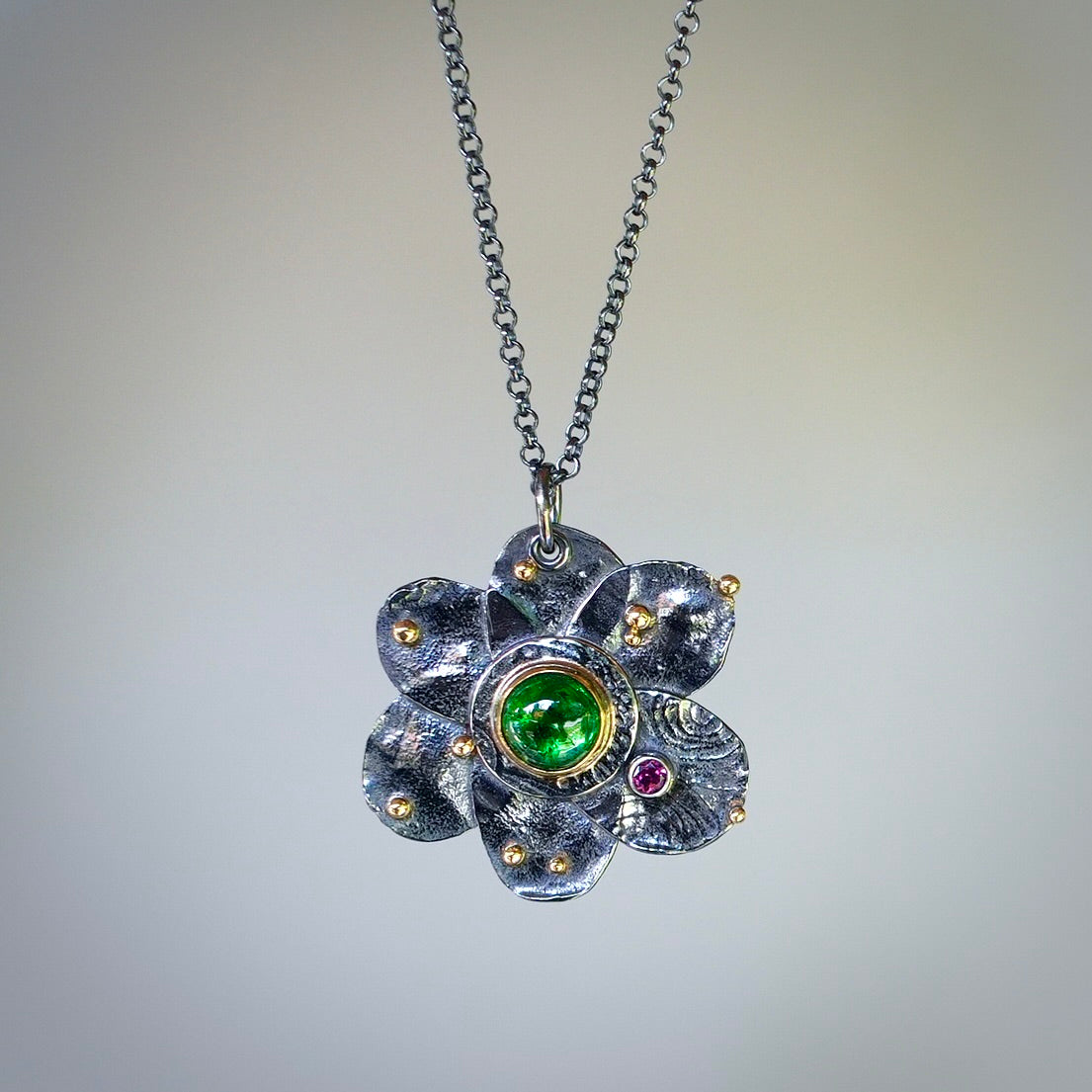 Tsavorite garnet flower pendant