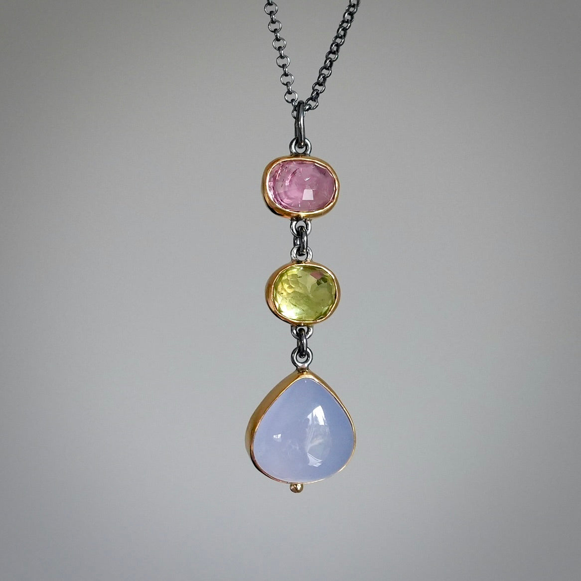 Tourmaline, sphene and blue chalcedony pendant