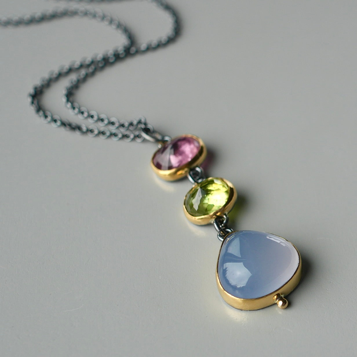 Tourmaline, sphene and blue chalcedony pendant