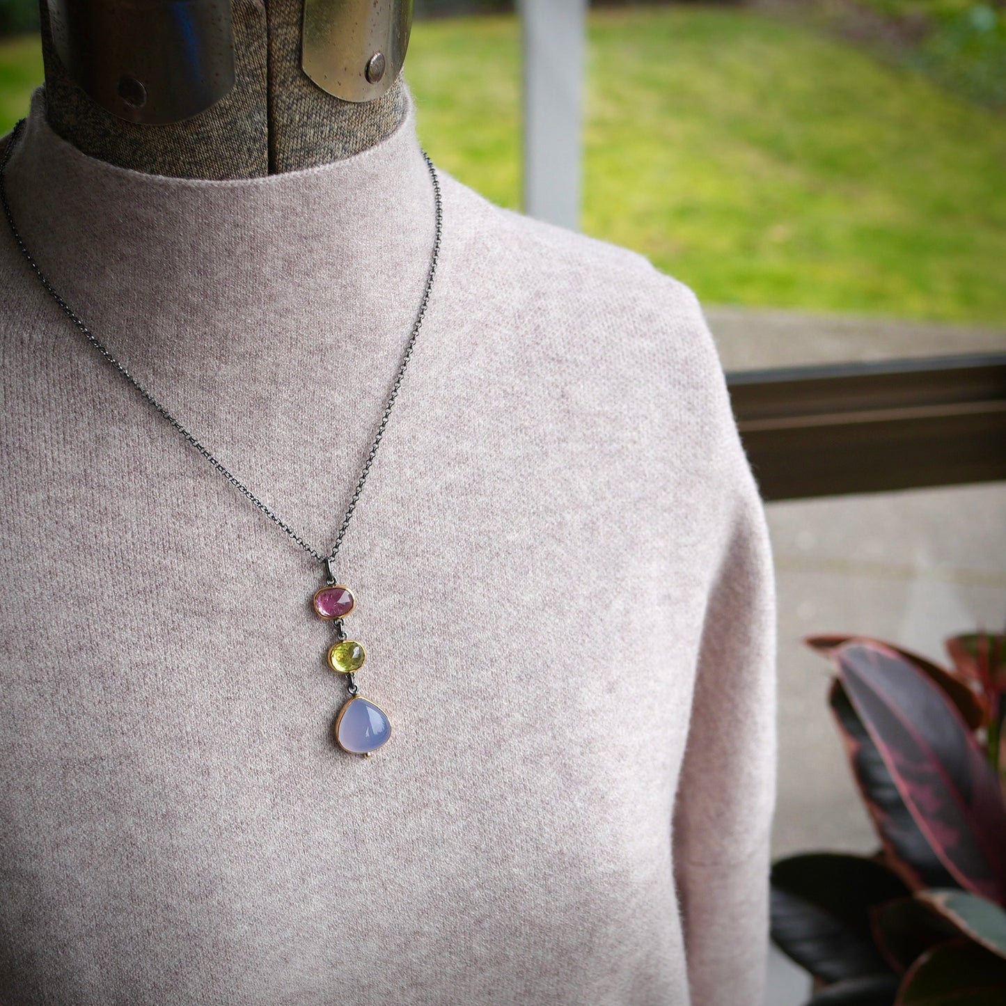 Tourmaline, sphene and blue chalcedony pendant