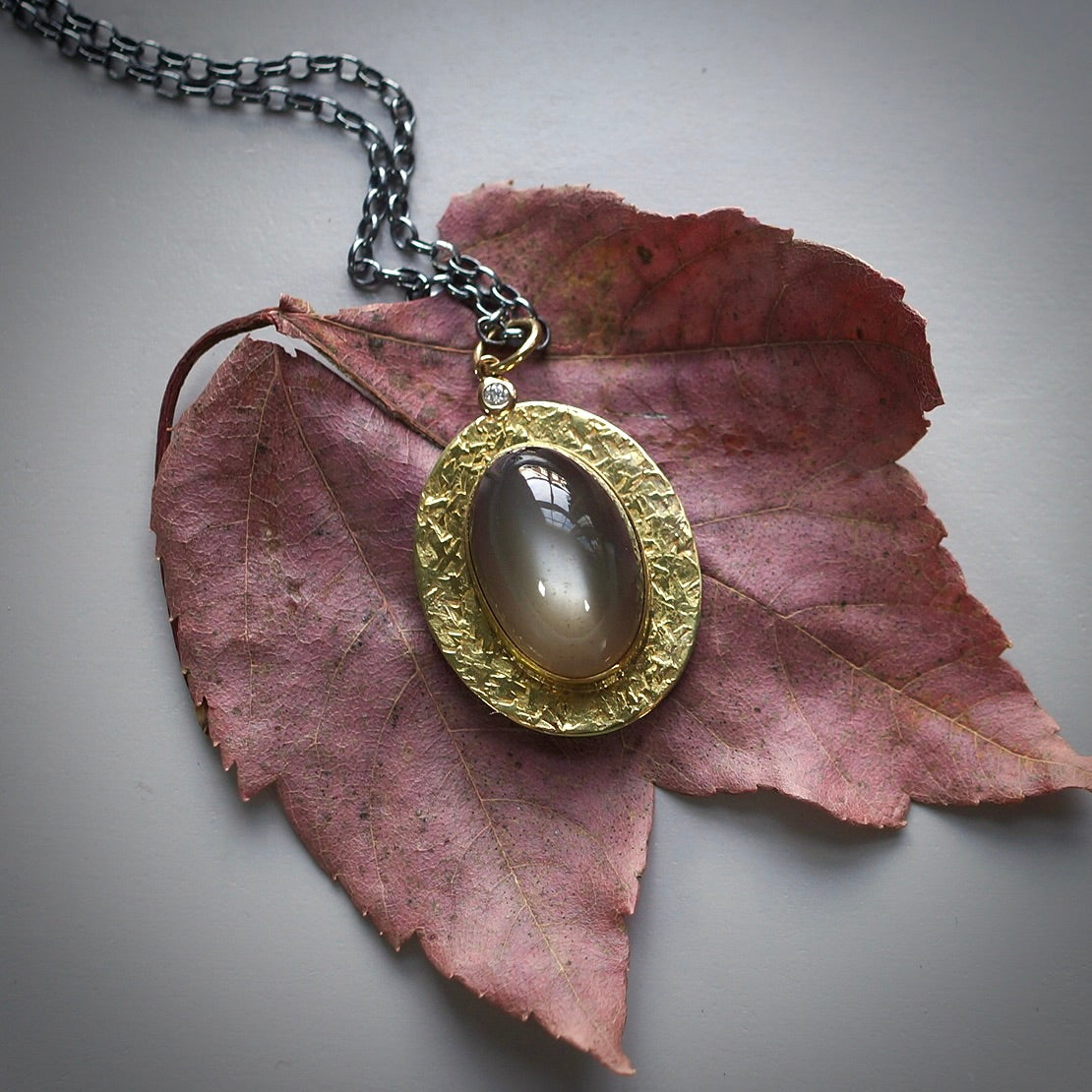 Green moonstone and diamond pendant