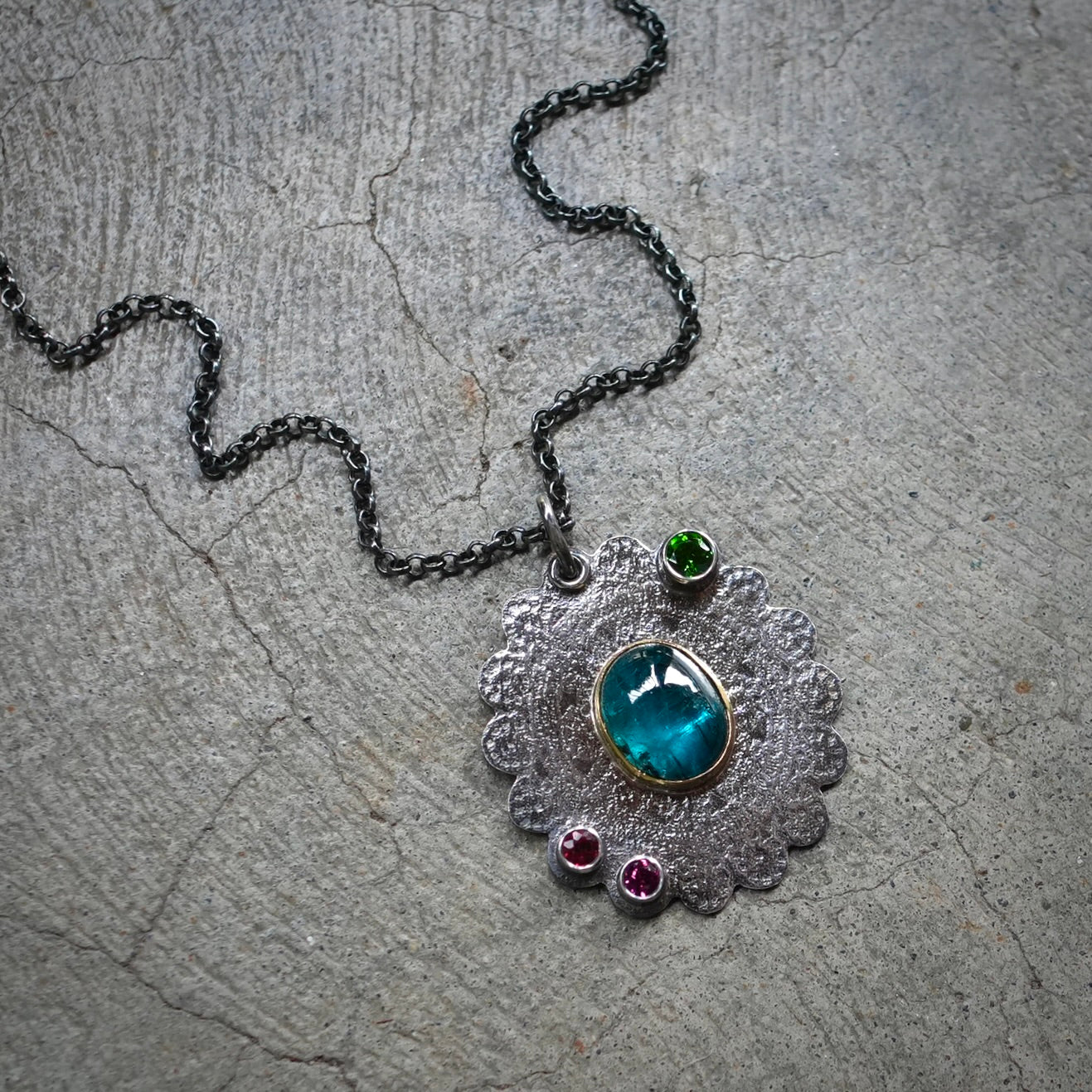 Teal blue kyanite pendant with colorful accents
