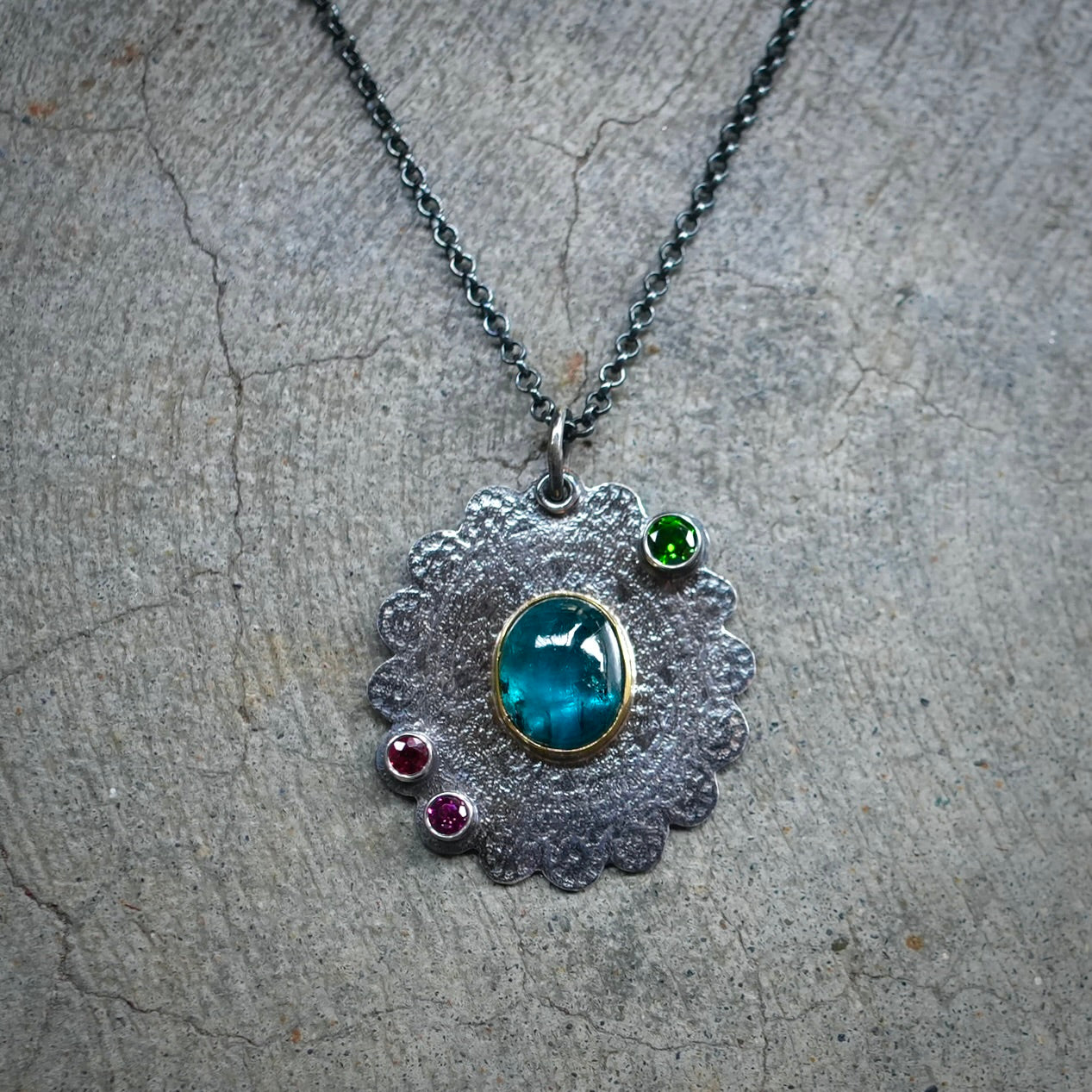 Teal blue kyanite pendant with colorful accents