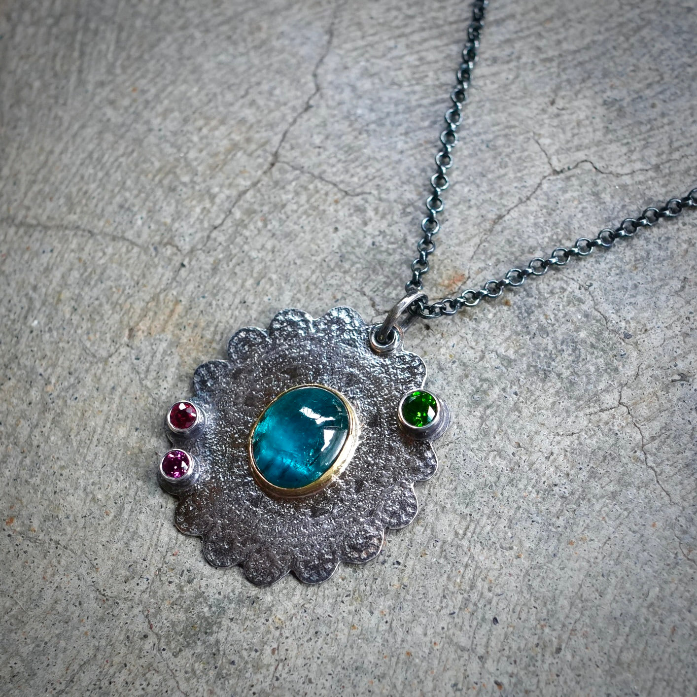 Teal blue kyanite pendant with colorful accents