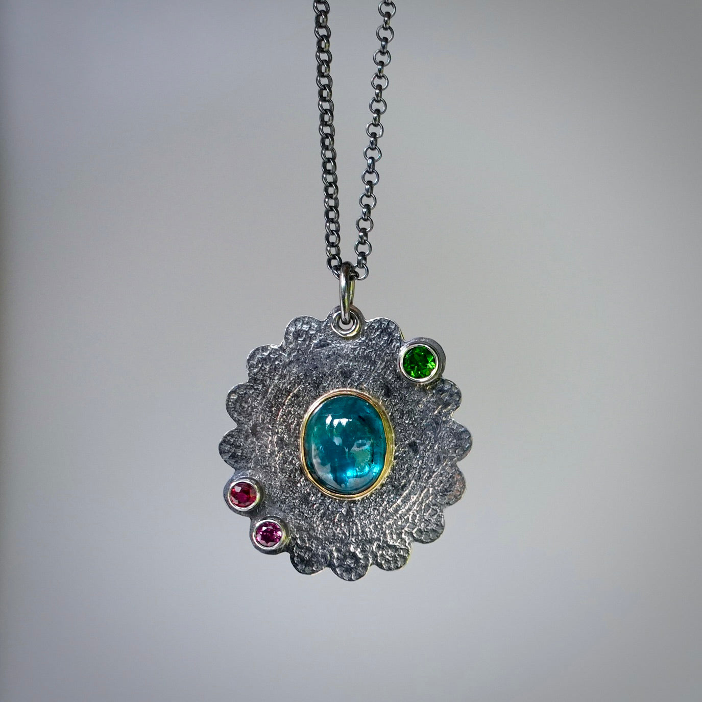 Teal blue kyanite pendant with colorful accents