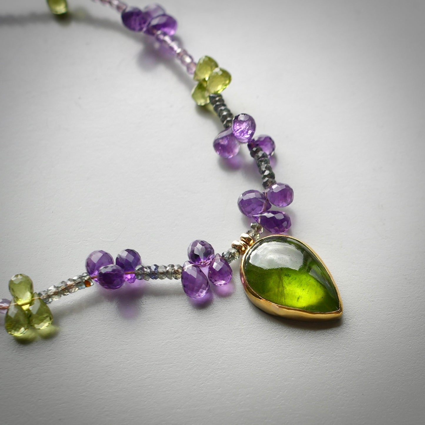 Vesuvianite necklace with amethyst, peridot and green sapphire