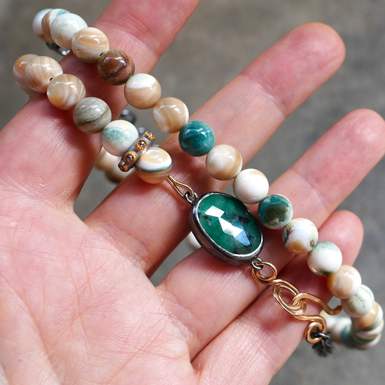 Beige and green mother of pearl necklace with accent diamond bead and rose cut emerald set in bezel