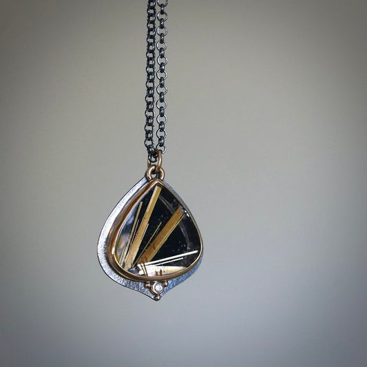 Rutilated quartz and back onyx doublet pendant with diamond