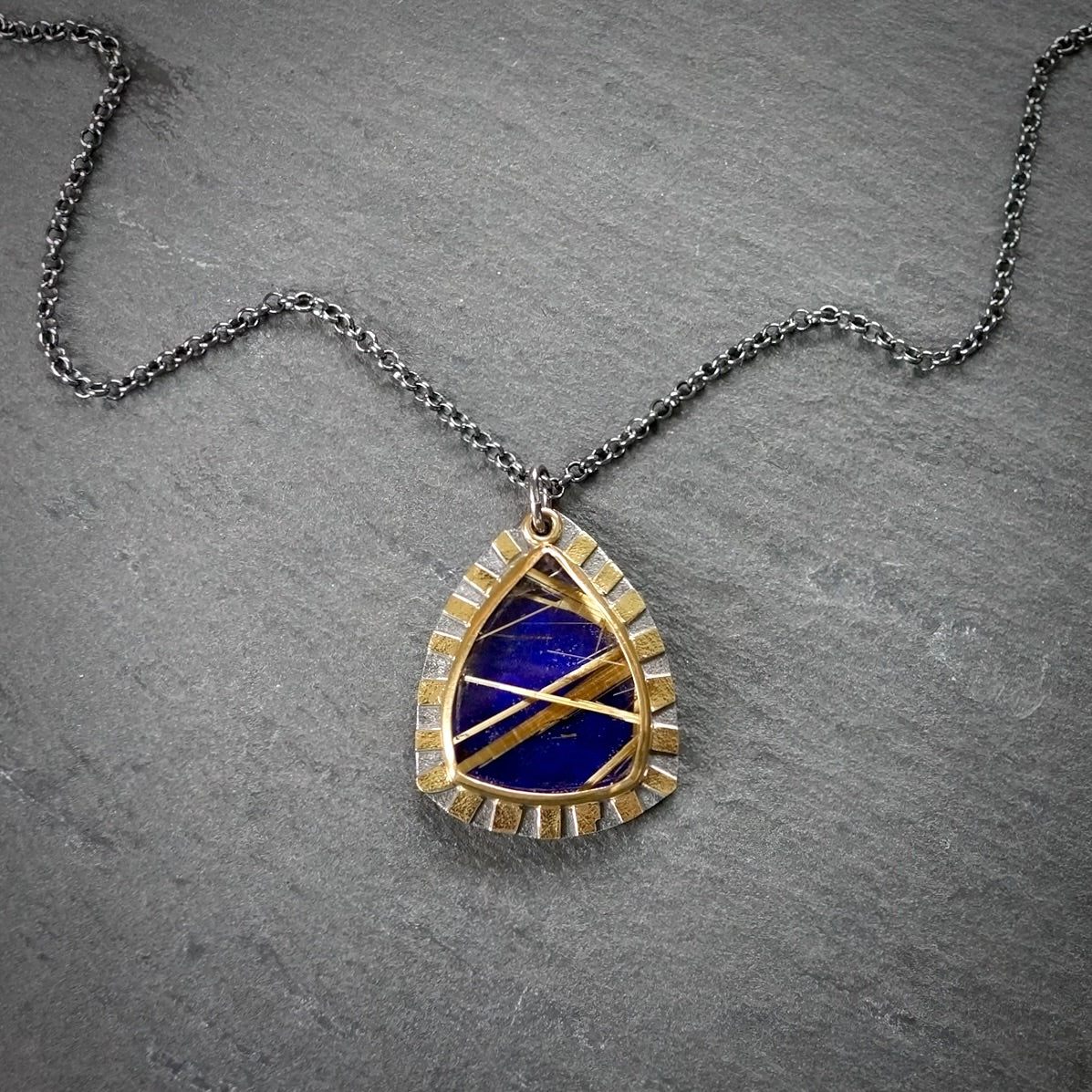 Rutilated quartz and lapis doublet pendant