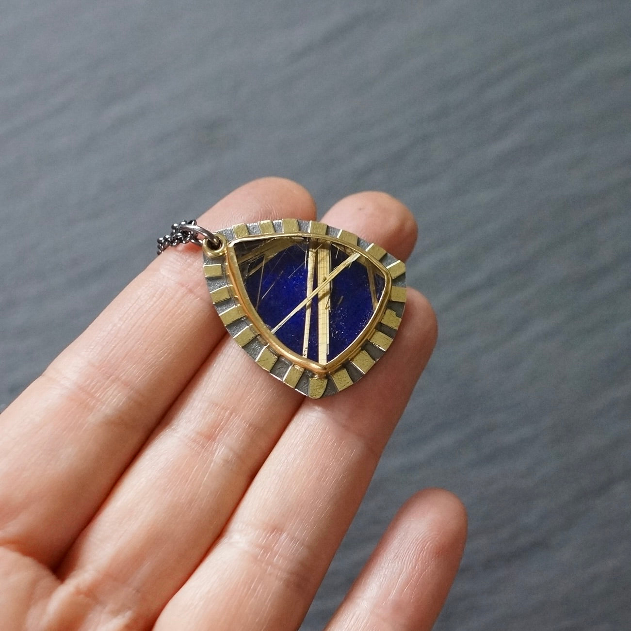 Rutilated quartz and lapis doublet pendant